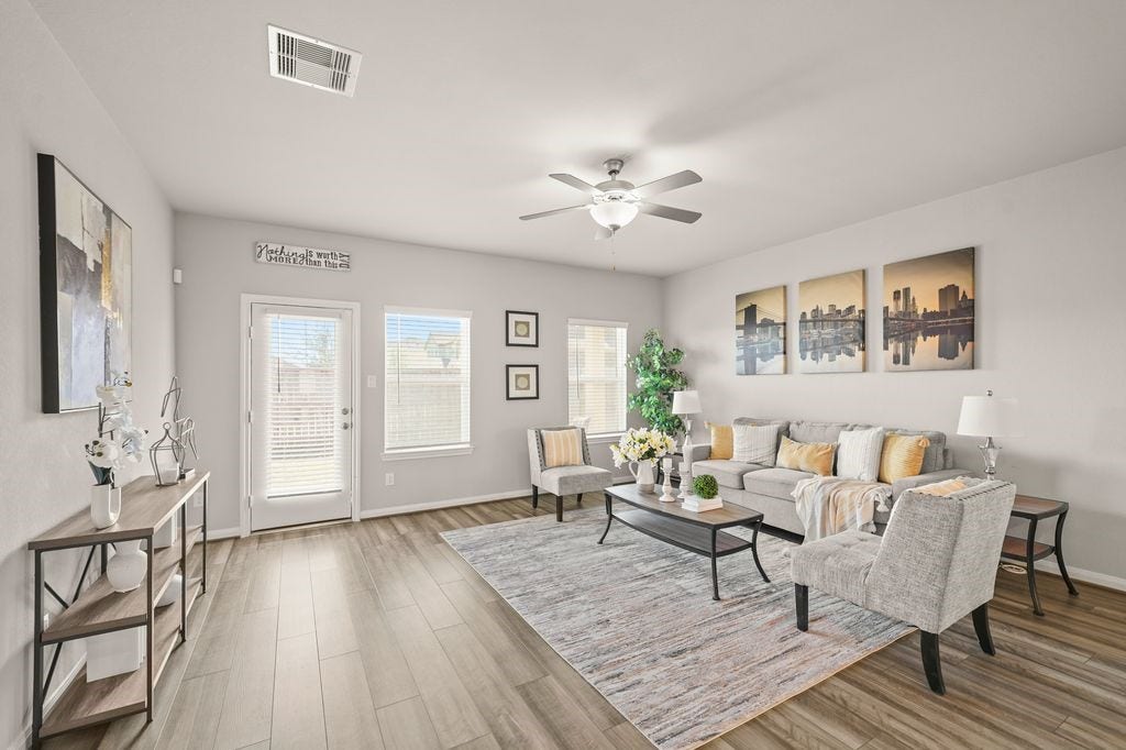 Inviting living area with ample seating space and direct views into the dining area - perfect for hosting.