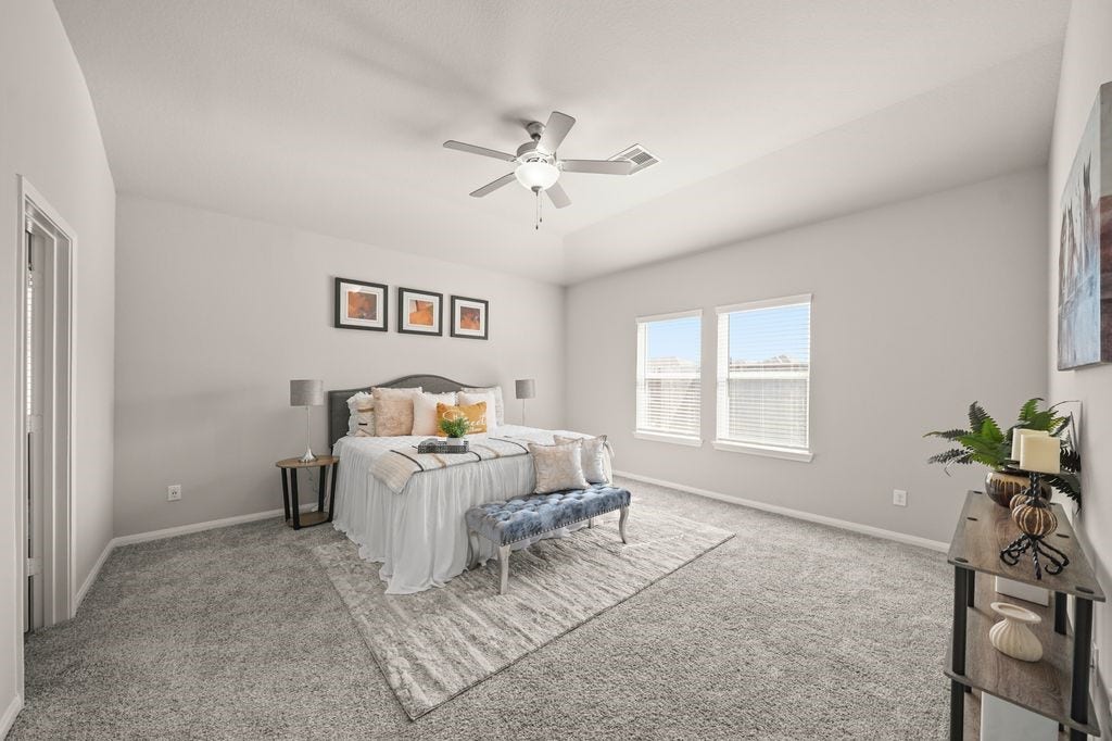 Primary Bedroom: Cozy primary suite with soft tones, plush carpet, and plenty of natural light.