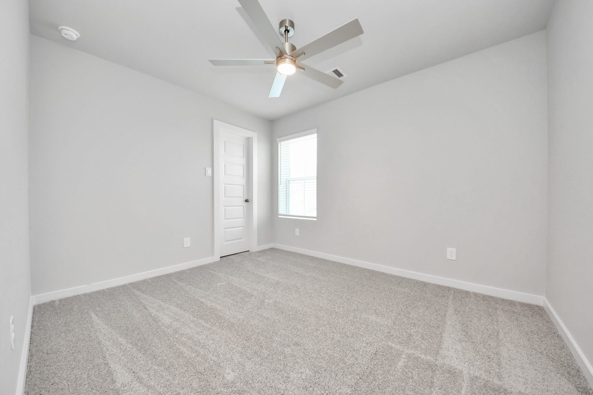 Generously sized secondary bedrooms featuring spacious closets, soft and inviting carpeting underfoot, large windows allowing plenty of natural light, and the added touch of privacy blinds for your personal retreat. Sample photo of completed home with similar floor plan. Actual colors and selections may vary.