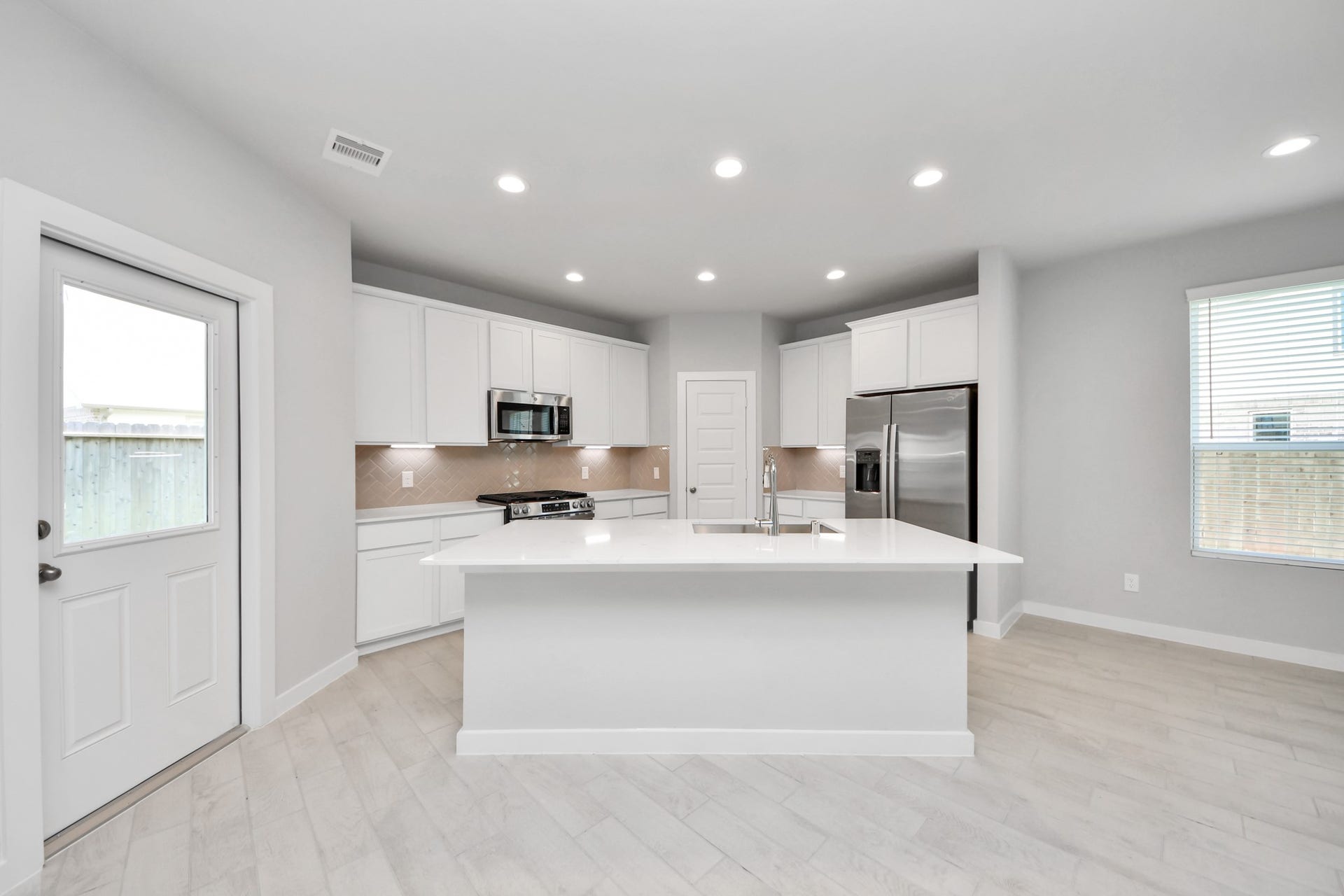 The extended counter area adds both practicality and style, making meal preparation a breeze. Every detail is thoughtfully designed to enhance the kitchen's functionality and aesthetic appeal. Sample photo of completed home with similar floor plan. Actual colors and selections may vary.