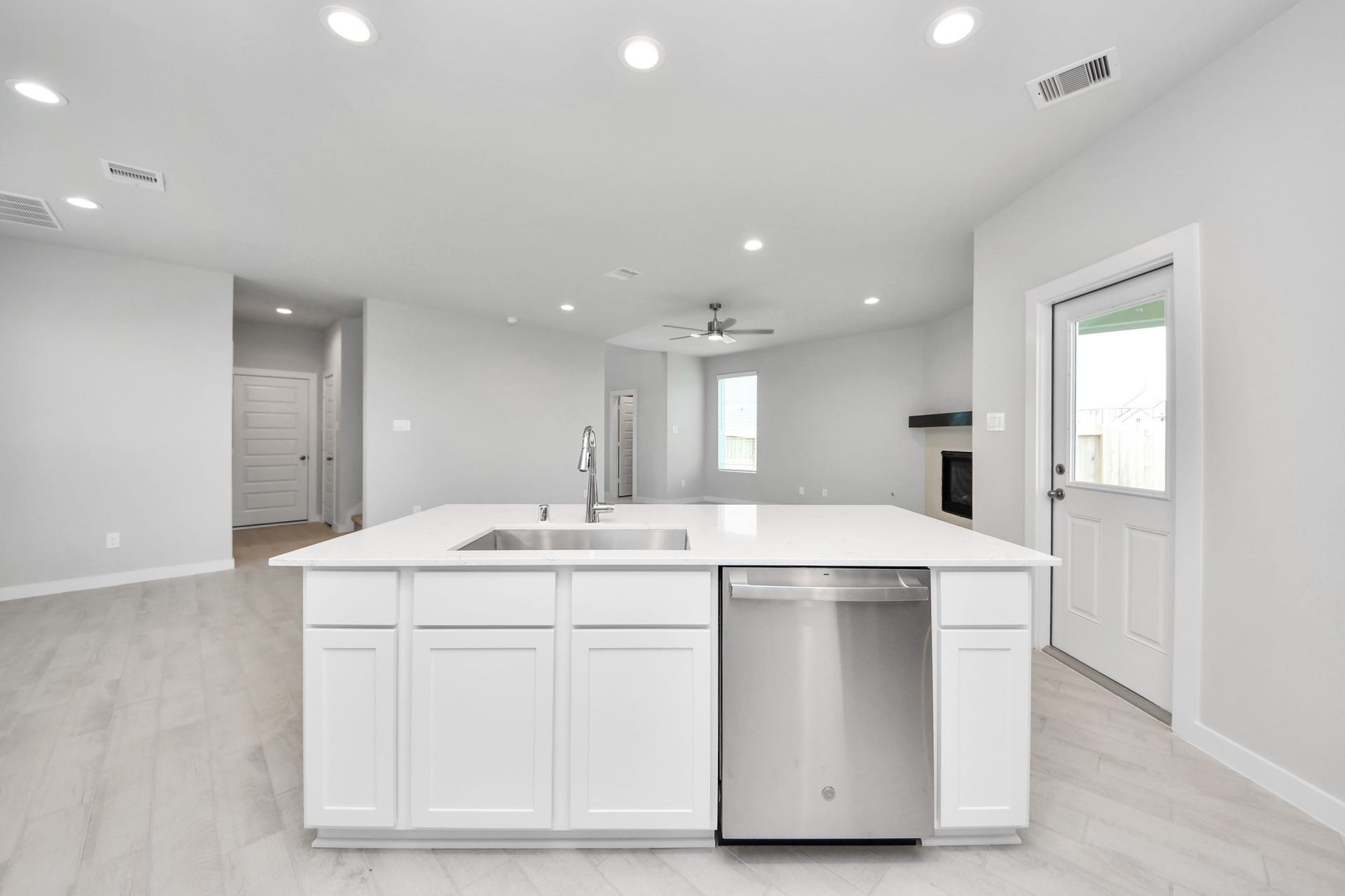 All of this overlooks your expansive family room, creating a perfect space for culinary delights and family gatherings. Sample photo of completed home with similar floor plan. Actual colors and selections may vary.