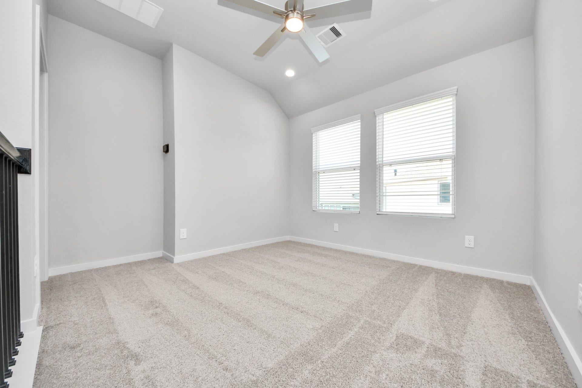 Come upstairs and relish a day of relaxation in this loft area! Ideal as an additional living space or game room, it boasts plush carpeting, high ceilings, custom paint, and windows that flood the area with abundant natural light. Sample photo of completed home with similar floor plan. Actual colors and selections may vary.