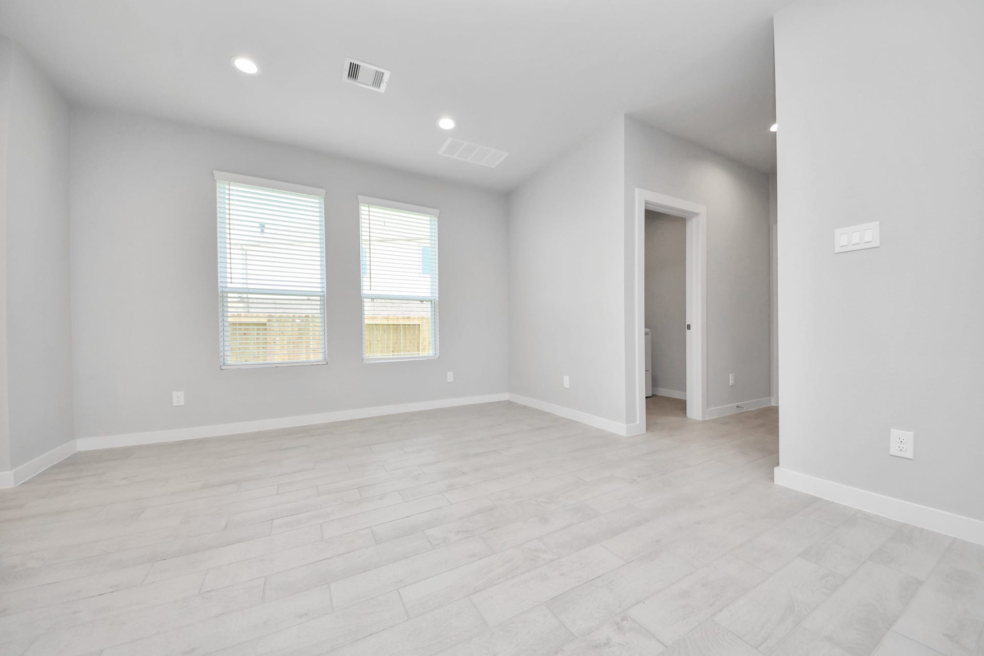 Make memories gathered around the table with your family and friends! This spacious dining room features elegant flooring, custom paint, and adjacent to family room and kitchen for open concept feel. Sample photo of completed home with similar floor plan. Actual colors and selections may vary.