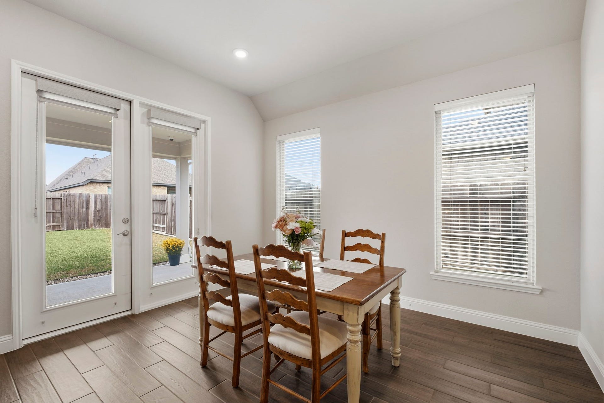 19314 Trotting Green Trail, Tomball, TX 77377 Bright dining area with large windows and French doors opening to the backyard & covered patio.