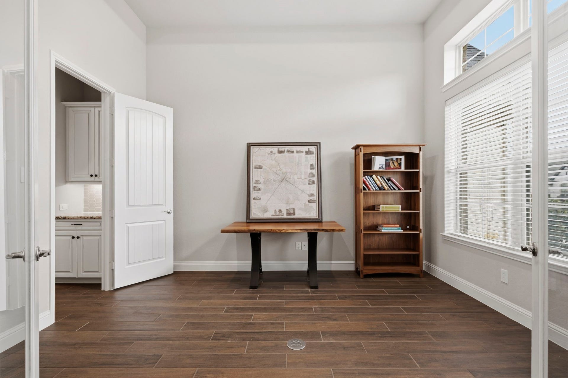 19314 Trotting Green Trail, Tomball, TX 77377 The office at the front of the home with a convenient floor outlet and lots of natural light from the windows.