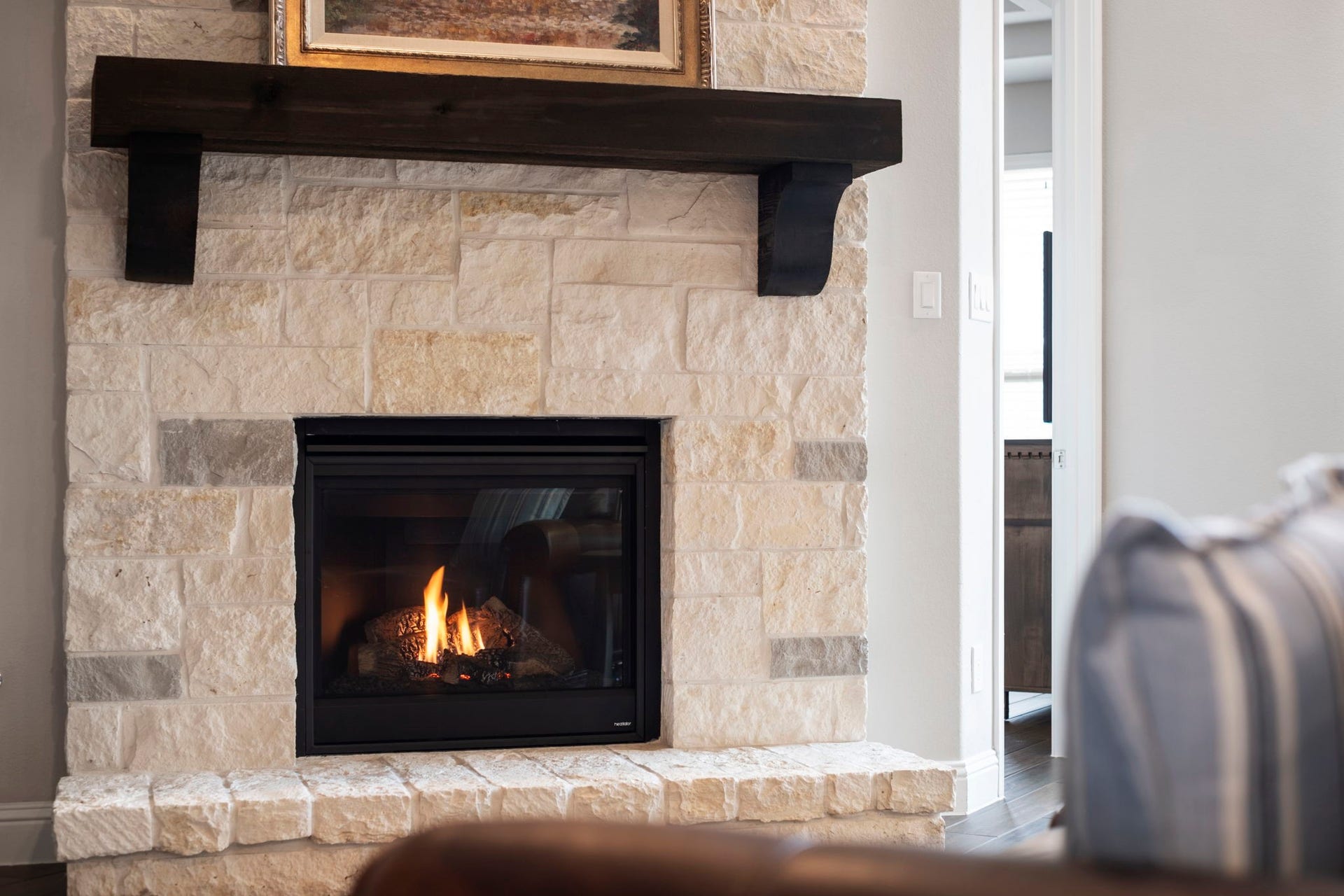 19314 Trotting Green Trail, Tomball, TX 77377 The gaslog fireplace provides hours of enjoyment on chilly days and evening. You can easily turn the fireplace using the wall switch.