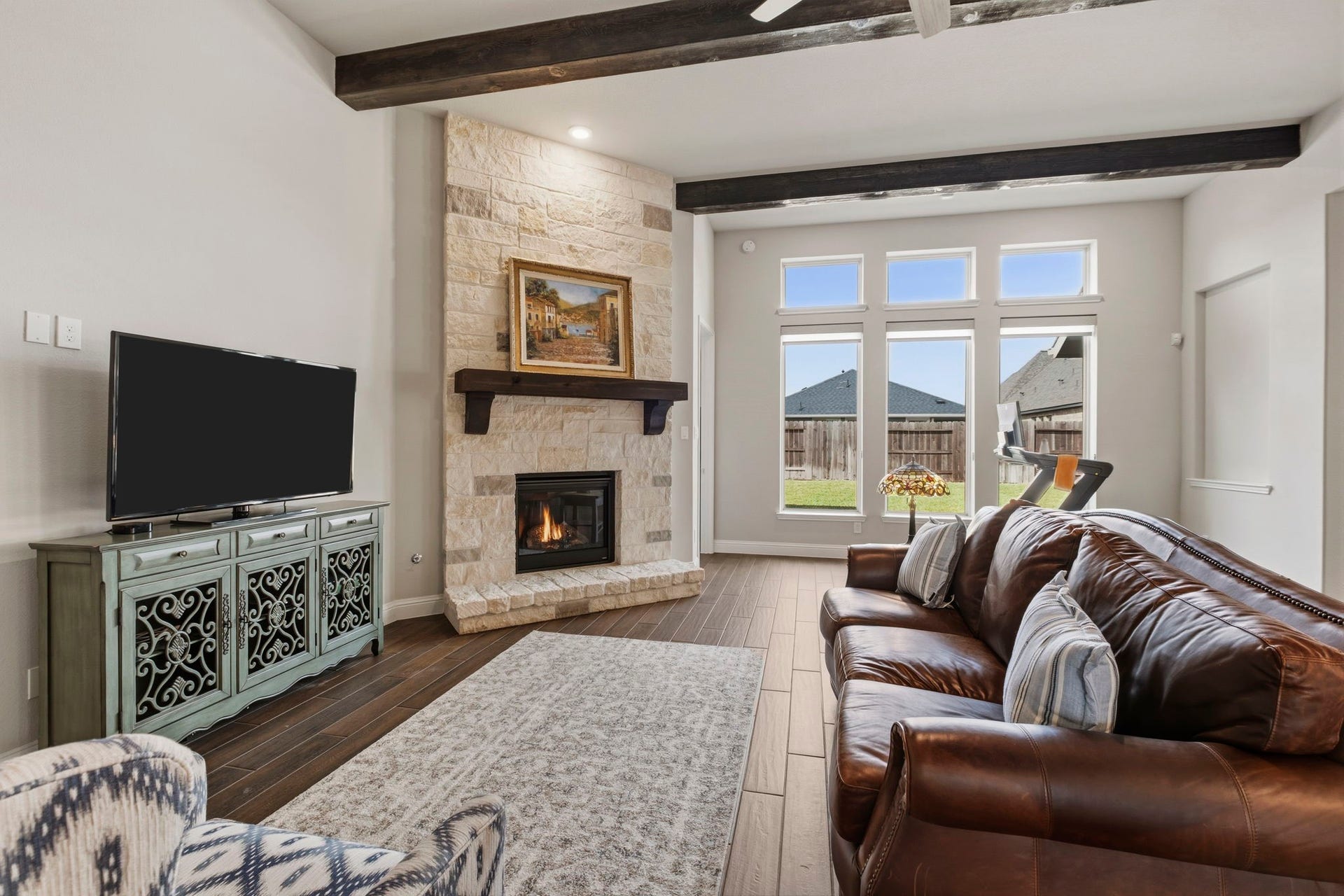 19314 Trotting Green Trail, Tomball, TX 77377 The wood beams along the family room ceiling adds charm and elegance