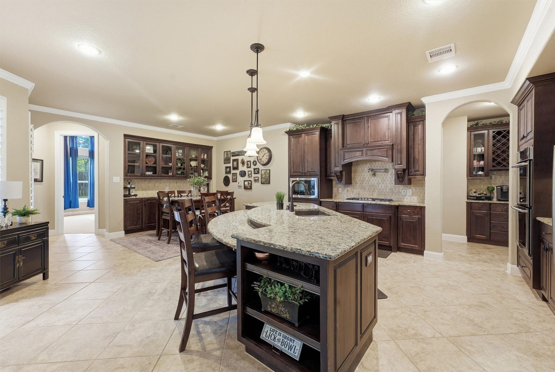 210 Fox Squirrel Court, Pinehurst, TX 77362 Abundant cabinetry and generous prep space.