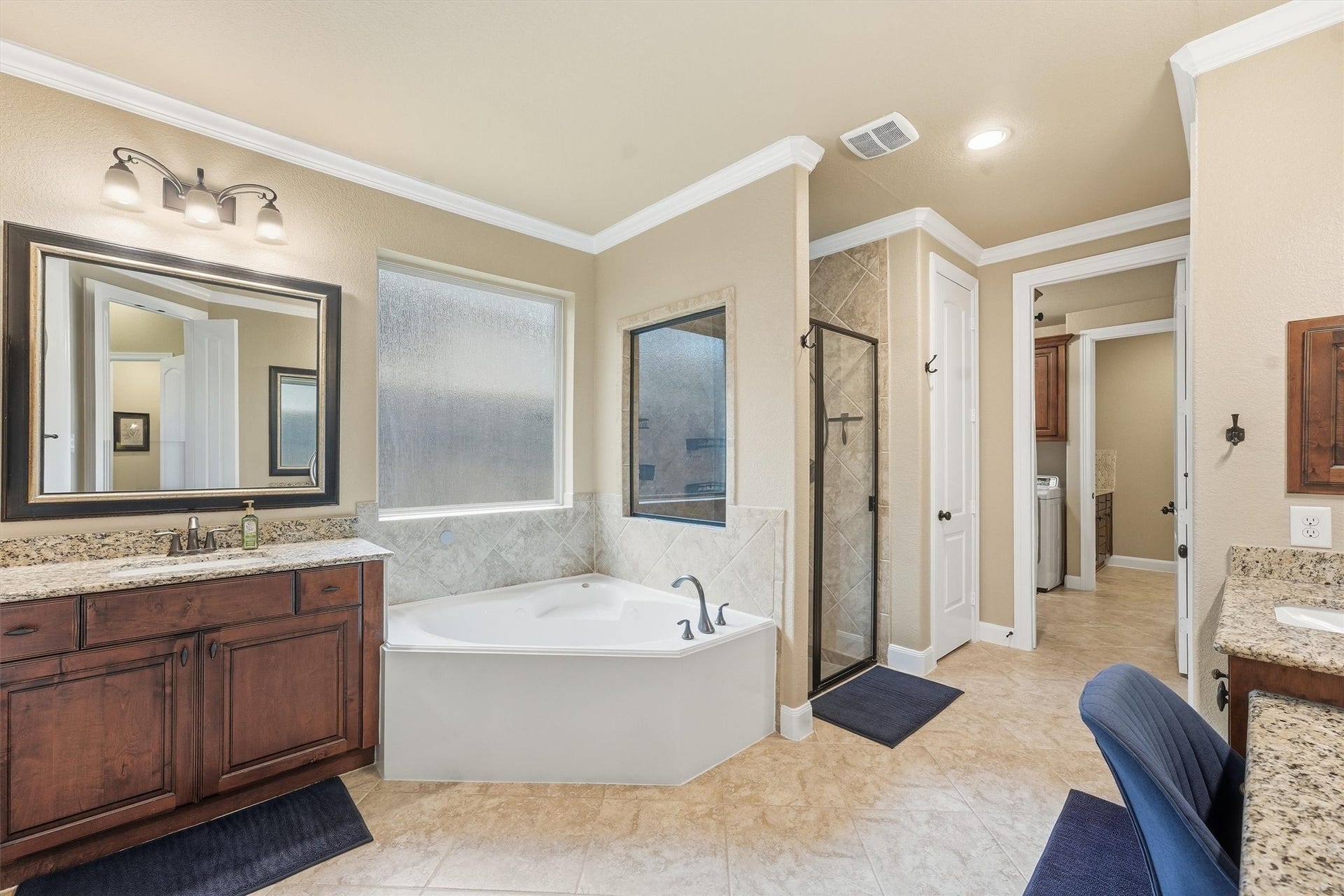 210 Fox Squirrel Court, Pinehurst, TX 77362 Spa-inspired primary bath with soaking tub.