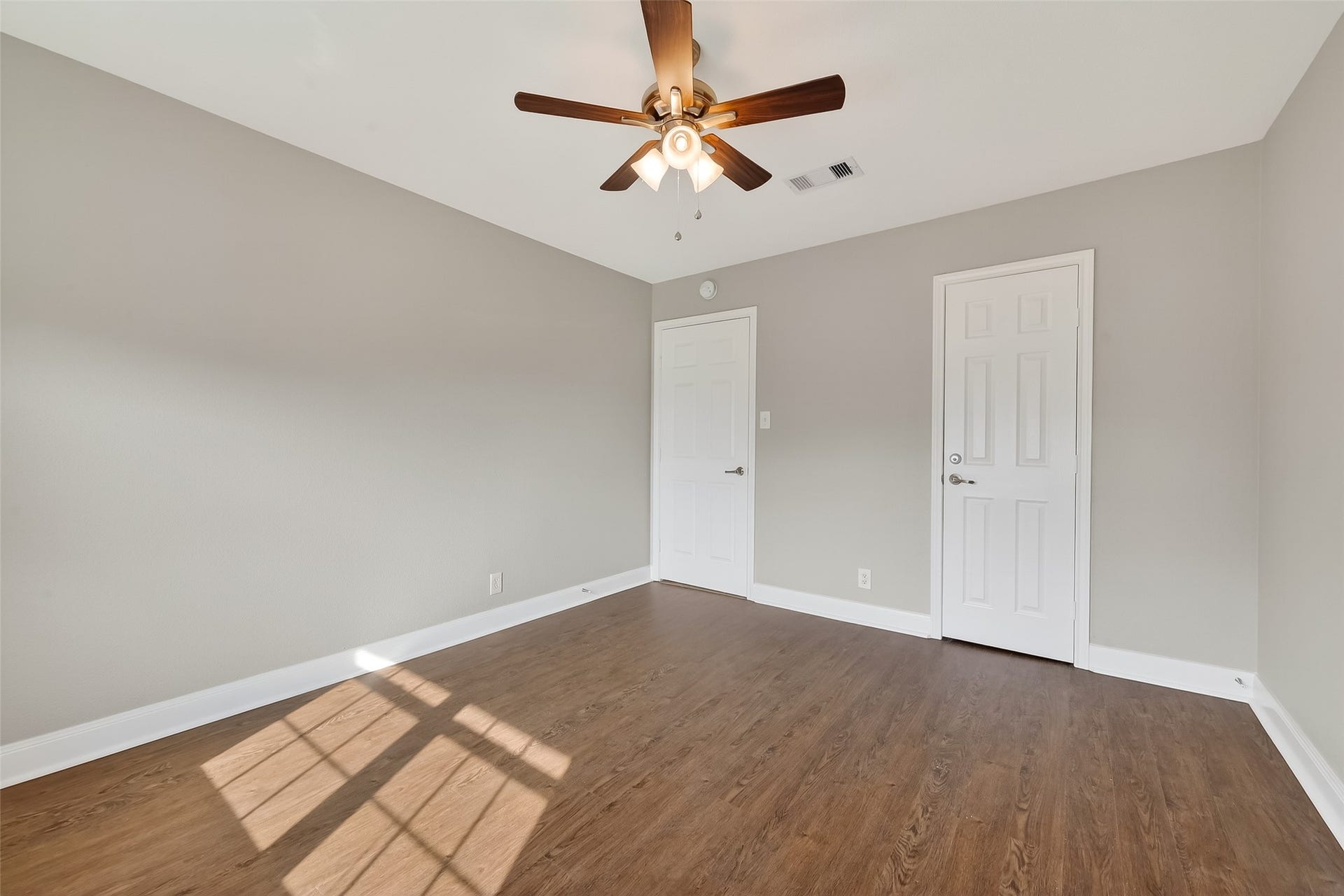 6351 Briar Rose Drive, #149, Houston, TX 77057 Spacious guest bedroom with natural light and updated finishes in this Houston townhome near the Galleria.