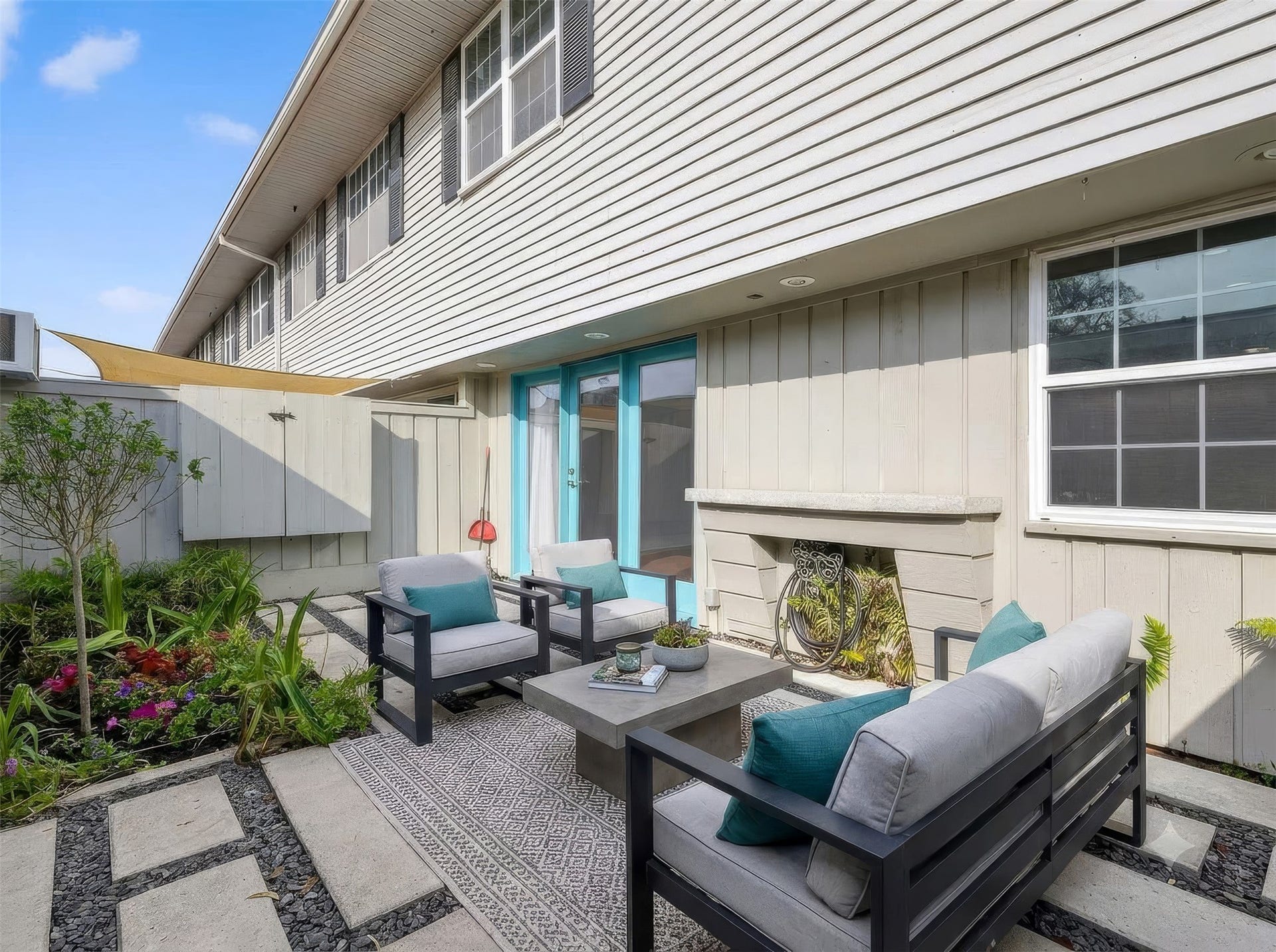 6351 Briar Rose Drive, #149, Houston, TX 77057 Private upgraded patio with pavers, outdoor TV hookup, and patio lighting ideal for outdoor entertaining in Houston.