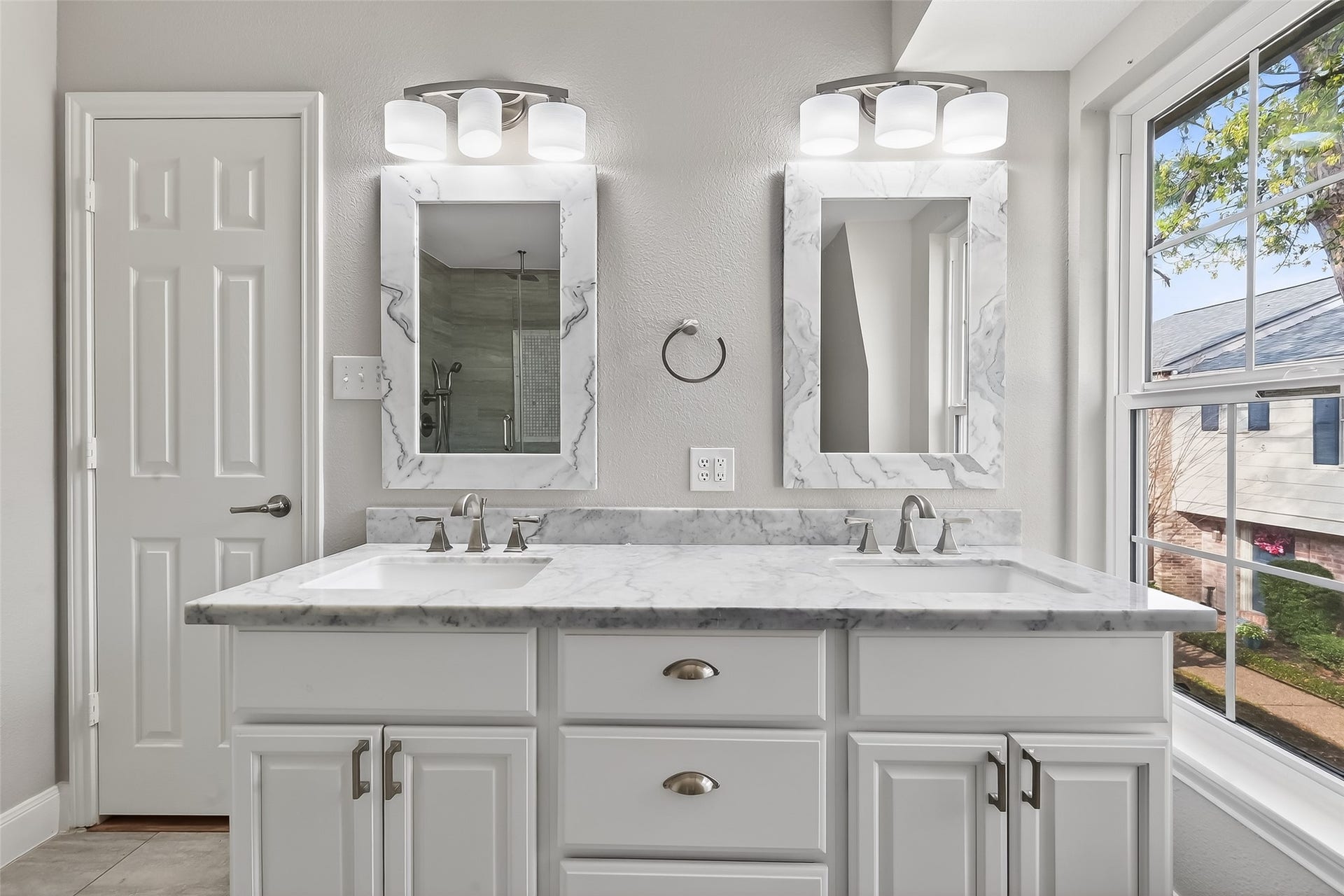6351 Briar Rose Drive, #149, Houston, TX 77057 Updated primary bathroom with custom walk-in rain shower, marble finishes, and modern designer details.