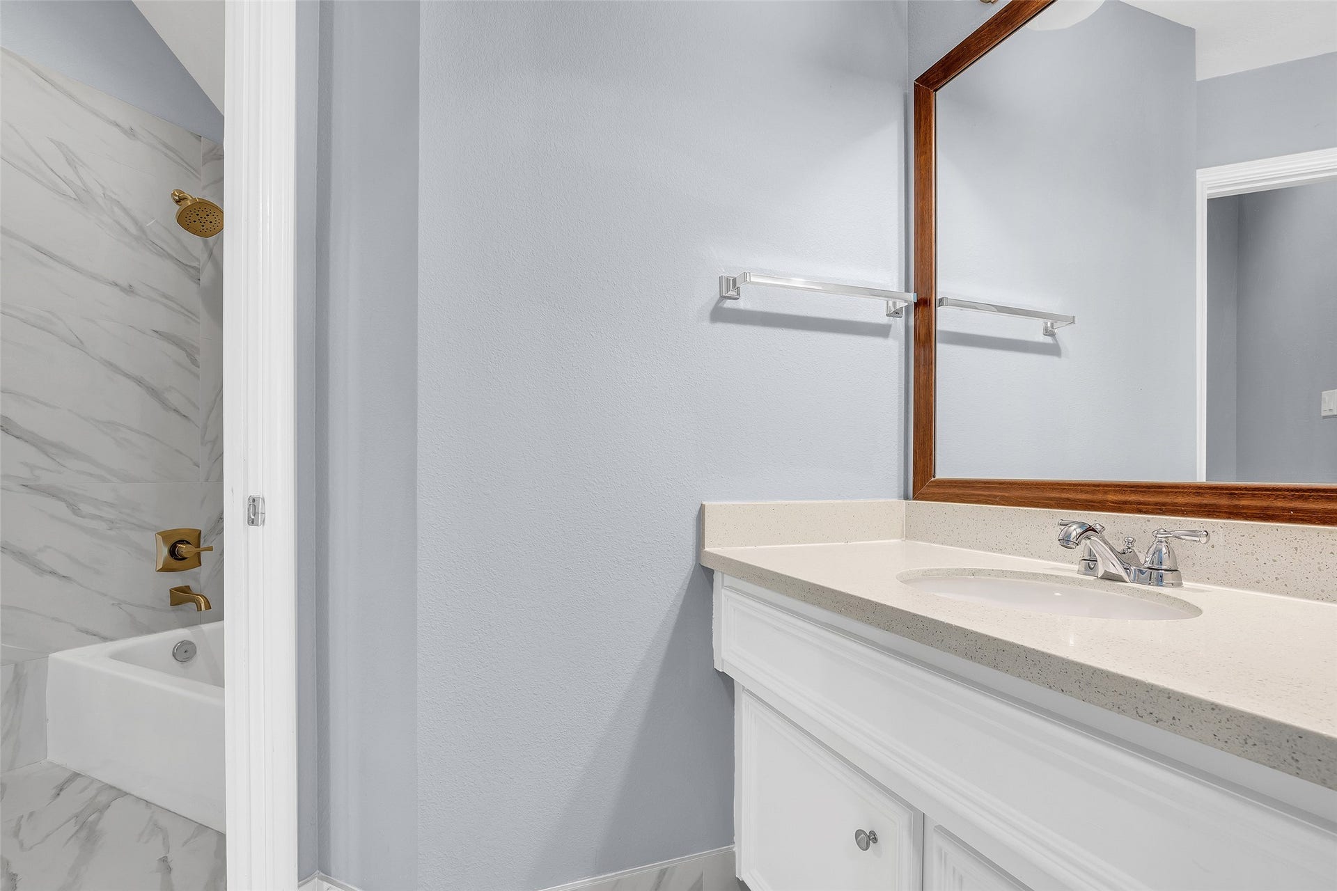 10626 Cortland Ridge Lane, Cypress, TX 77433 Sleek bathroom featuring elegant fixtures and a separate sink, perfect for modern living.