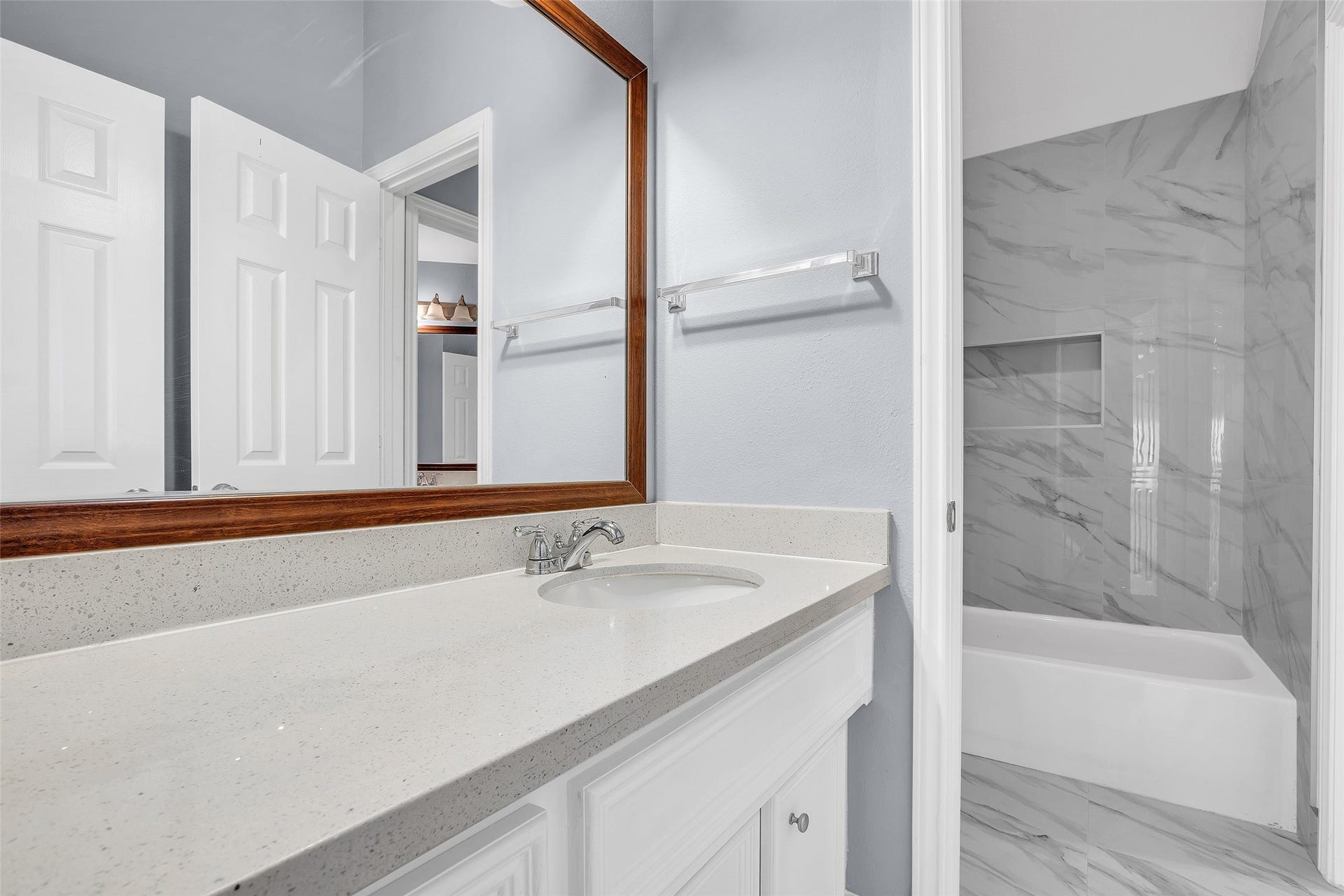 10626 Cortland Ridge Lane, Cypress, TX 77433 Your elegant Jack and Jill bathroom, featuring modern fixtures and a sleek design perfect for shared living.