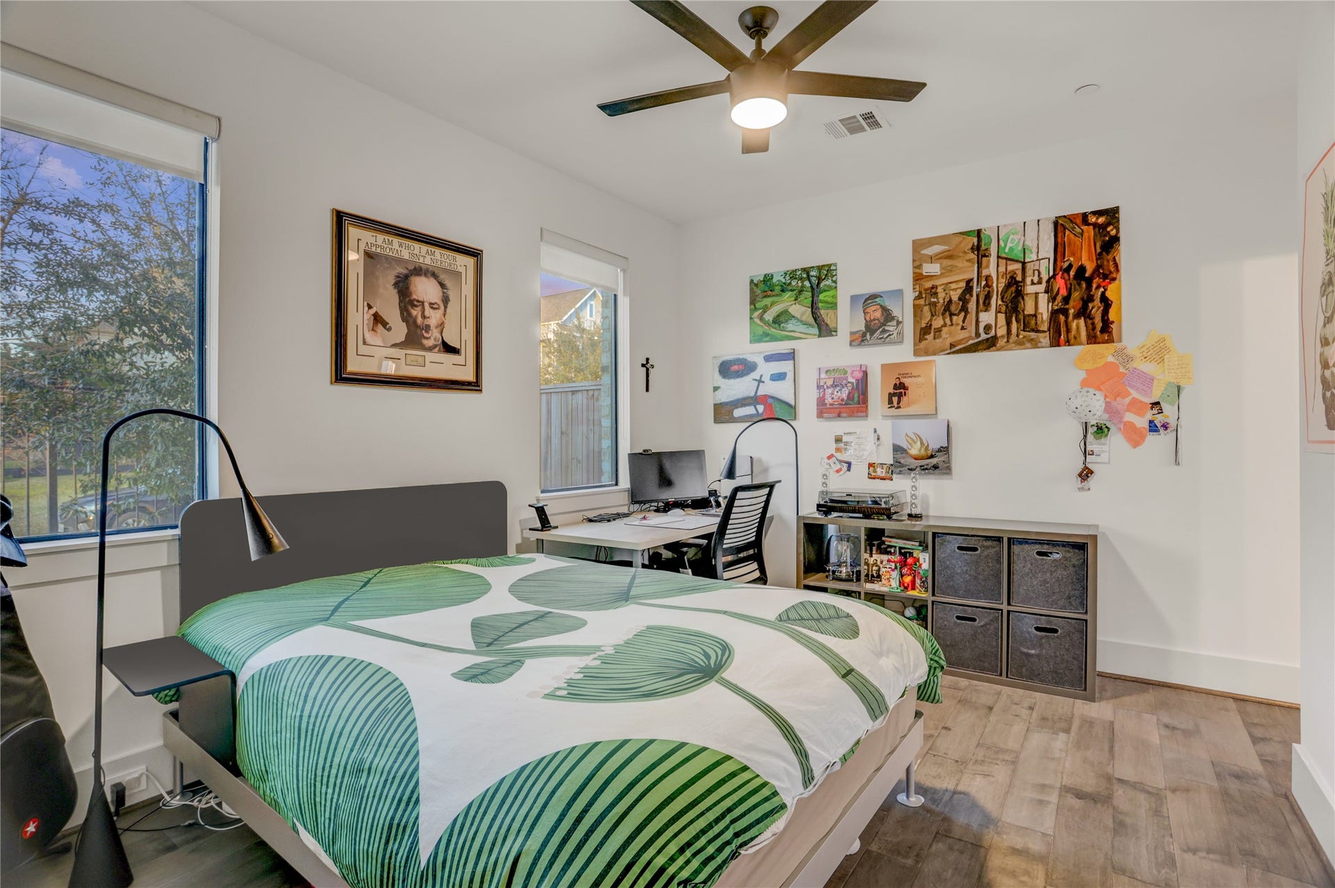 2435 Sheridan Street, Houston, TX 77030 Cozy secondary bedroom with ample natural light, modern ceiling fan, and versatile space for work or relaxation.