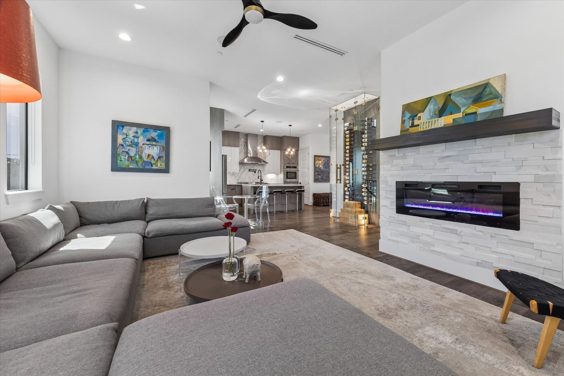 2435 Sheridan Street, Houston, TX 77030 The living room featuring a modern fireplace, open layout, and stylish finishes.
