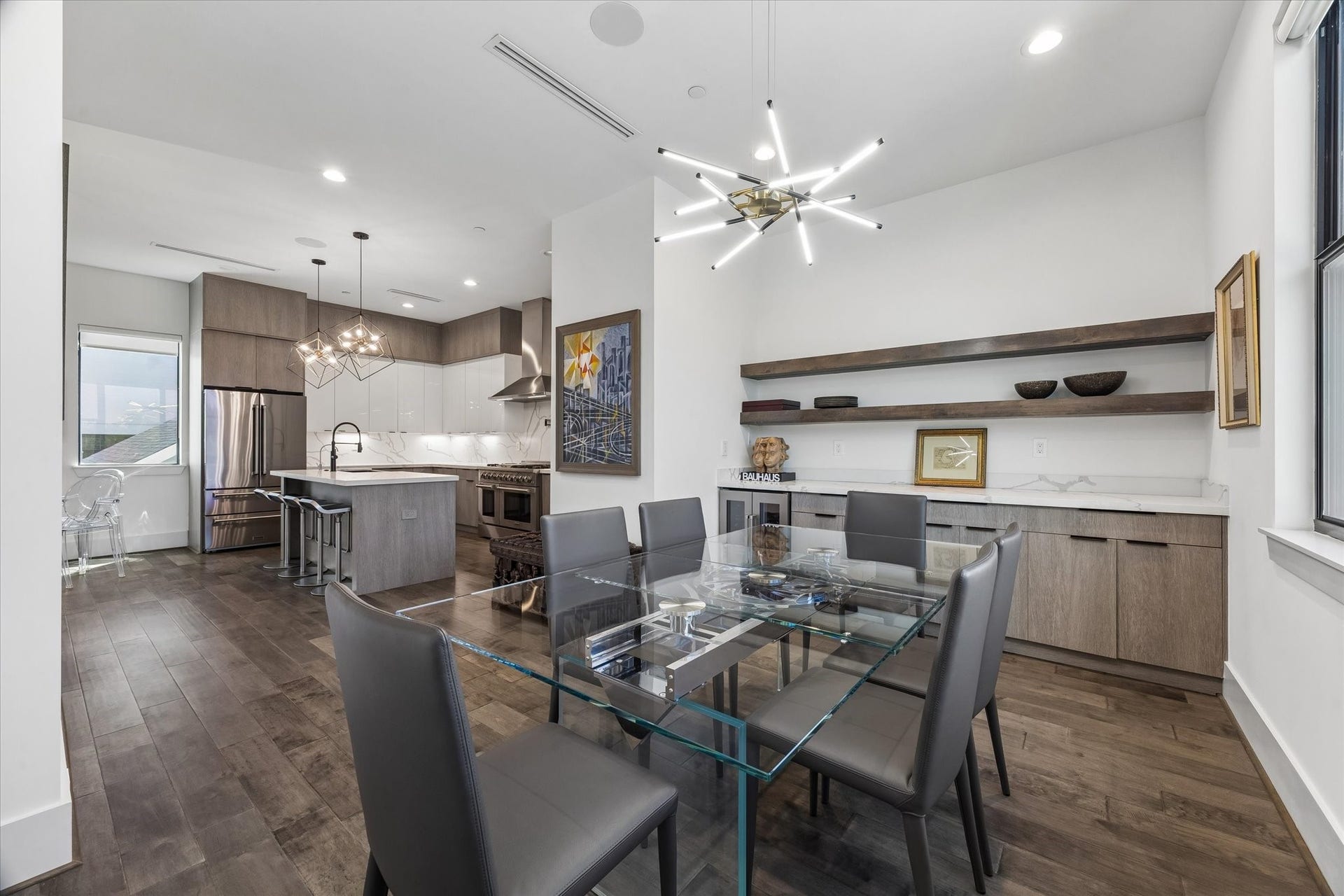 2435 Sheridan Street, Houston, TX 77030 The dining area with stylish shelving, is seamlessly connected to the kitchen.