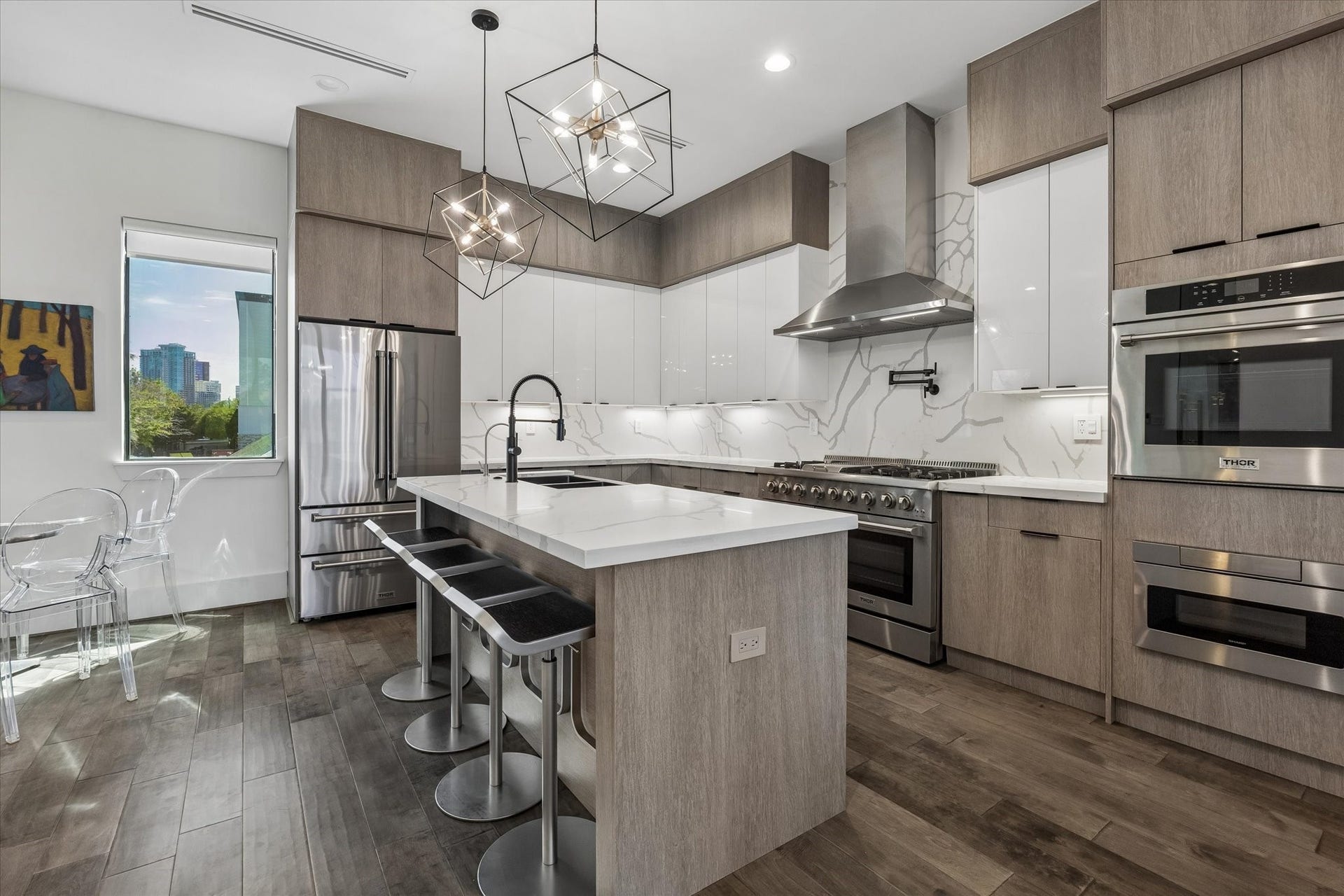 2435 Sheridan Street, Houston, TX 77030 Sleek, modern kitchen with elegant fixtures, a spacious island, and open layout.