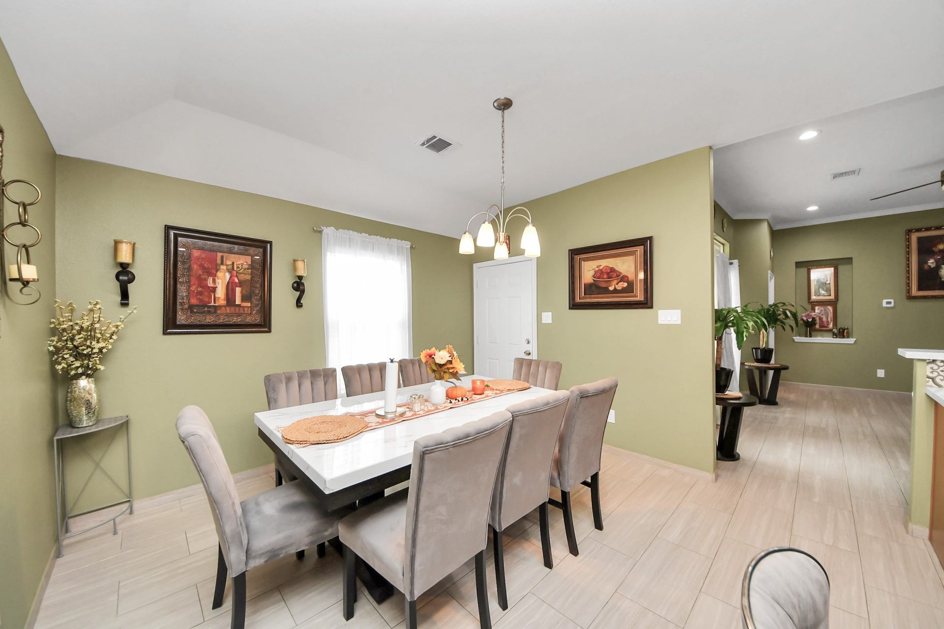 An open view connects the dining area with the living room.