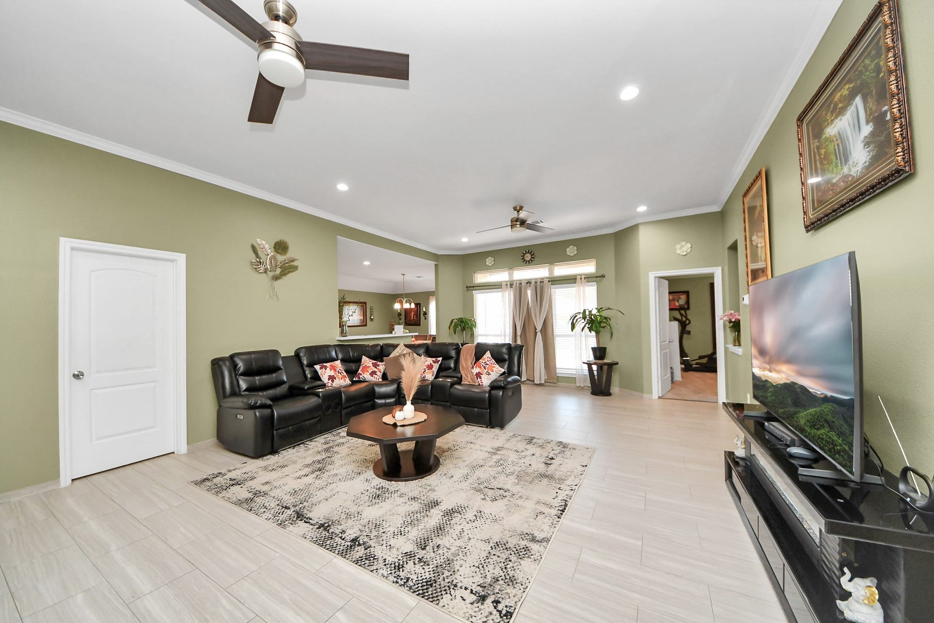 Tile flooring connects the living room with the entry hall.