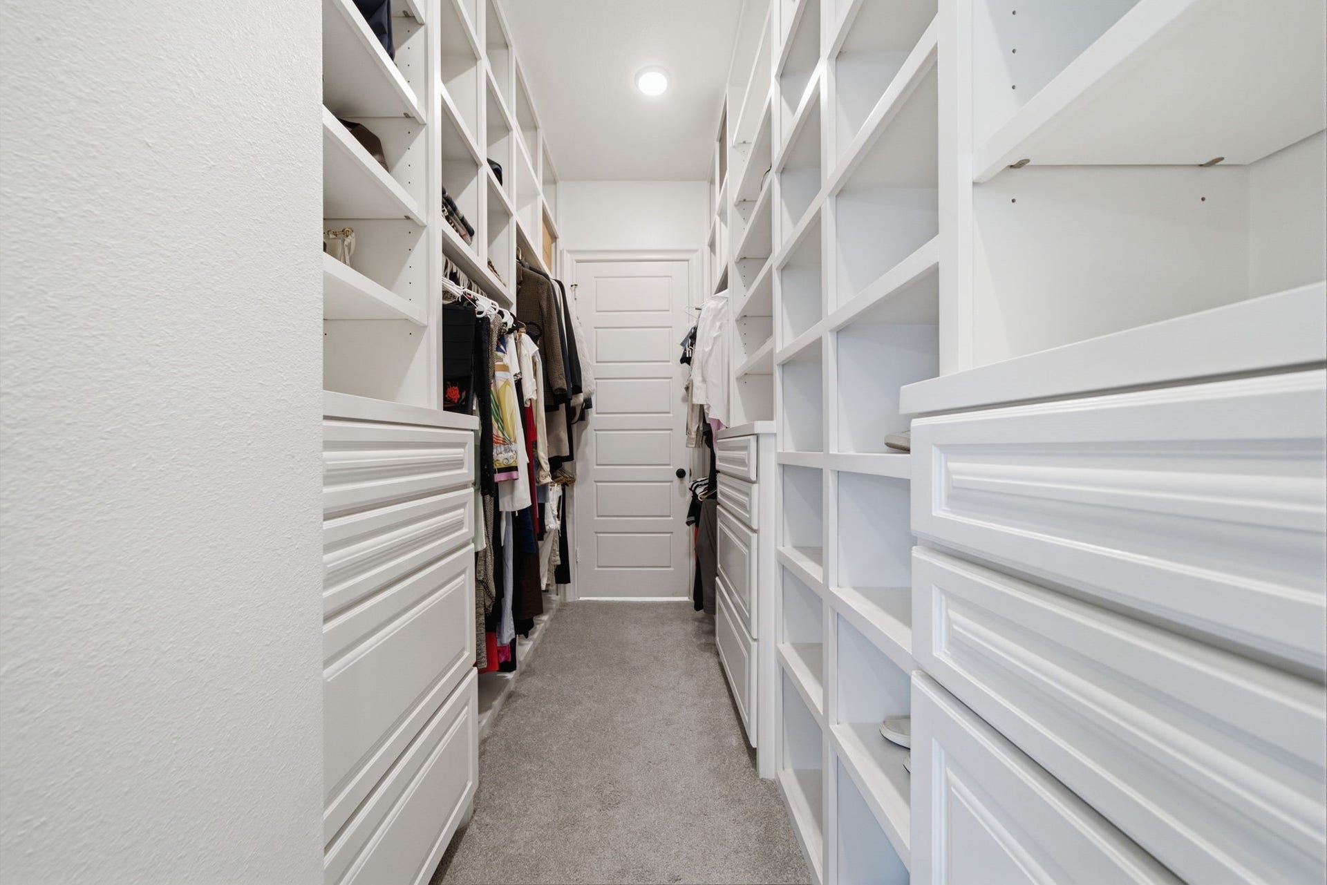 6310 Star Light Court, Spring, TX 77386 Spacious walk-in closet featuring abundant shelving and storage solutions for organized living.