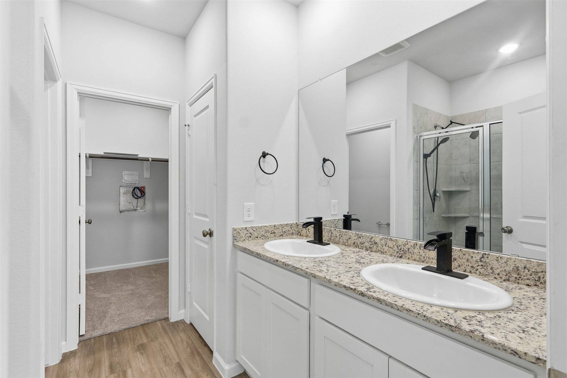 29 Valiant Ridge Trail, Magnolia, TX 77354 Sleek bathroom featuring a dual-sink, vanity, elegant fixtures, and a modern tiled shower, and walk in closet