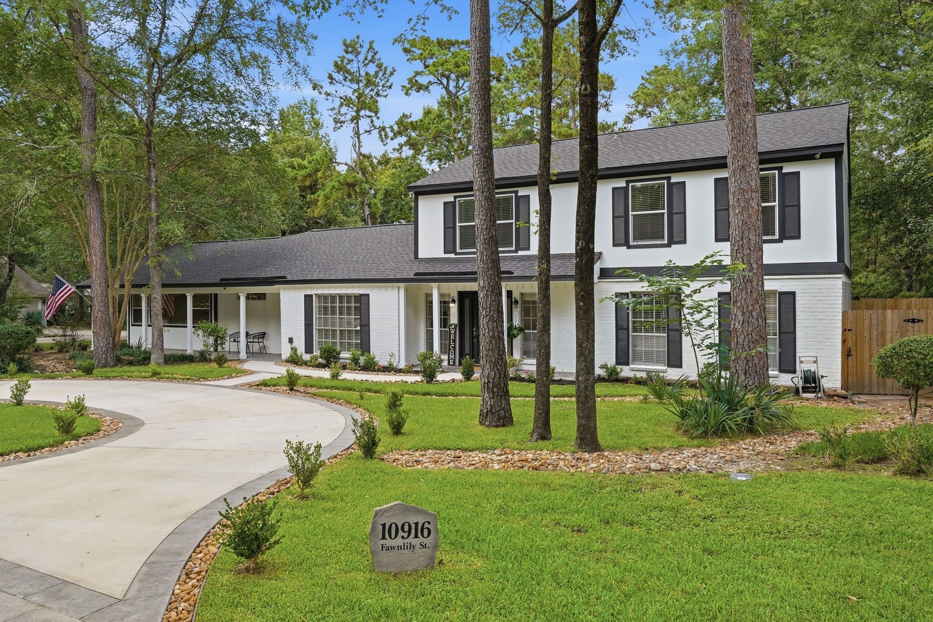 10916 Fawnlily Street, The Woodlands, TX 77380 This home looks good from any angle! Check out that roof replaced in 2024 and the striking modern exterior.