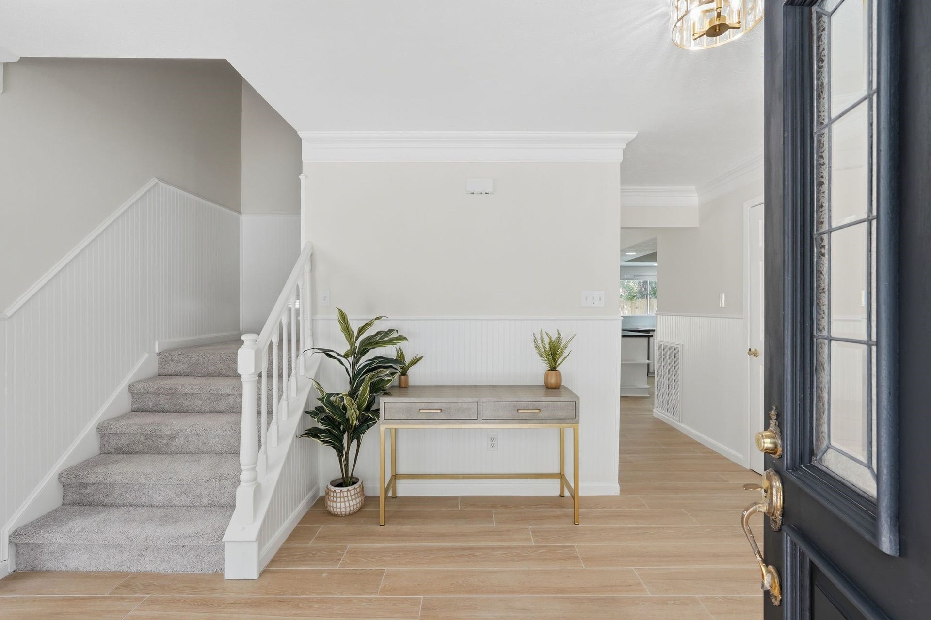 10916 Fawnlily Street, The Woodlands, TX 77380 Welcome inside! You're greeted by a formal entryway with an area perfect for a table to drop your keys, a decorative bench to store shoes and get ready for the day, or anything else your Pinterest board has saved for your next home.