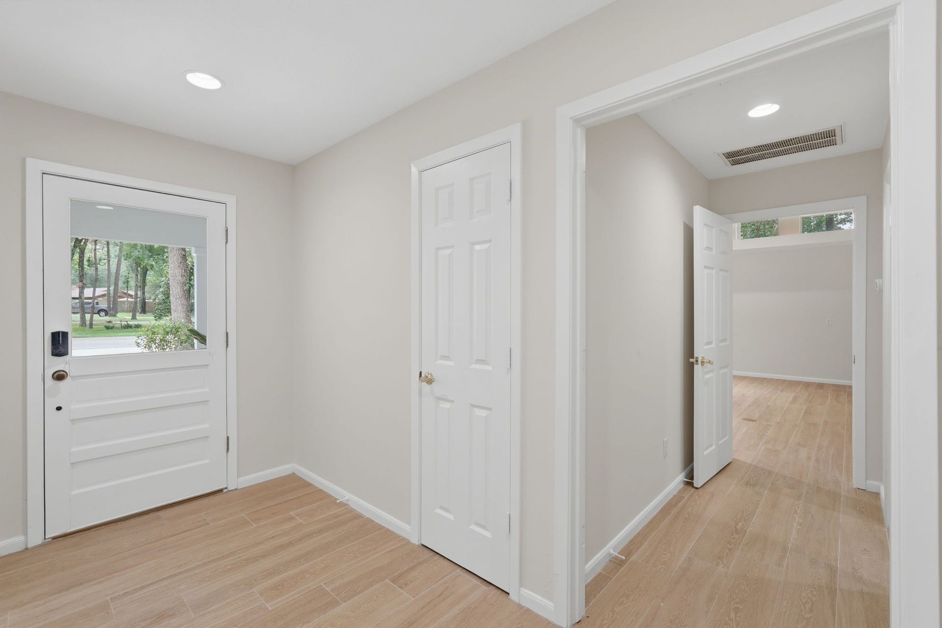 10916 Fawnlily Street, The Woodlands, TX 77380 Just inside the door and to the left is a hallway with your laundry room and primary bedroom down it.