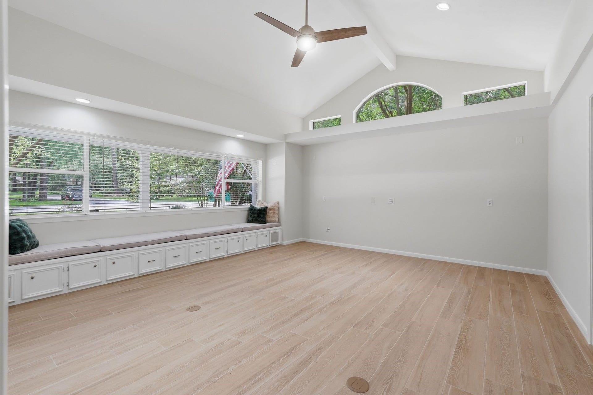 10916 Fawnlily Street, The Woodlands, TX 77380 Did someone request the primary bedroom of your dreams? Your wish is our command! This primary bedroom has vaulted ceilings and a bench that runs along the windows for a true wow factor.