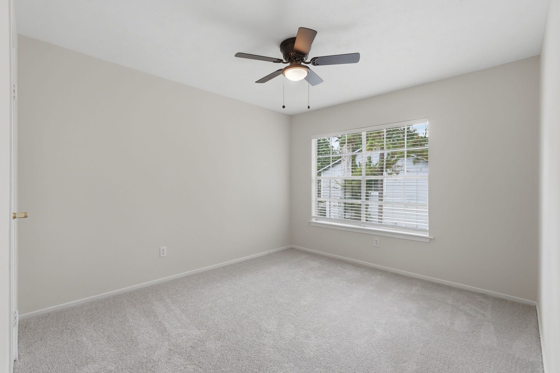 10916 Fawnlily Street, The Woodlands, TX 77380 And last but not least, the third secondary bedroom upstairs again with a large window and walk in closet.