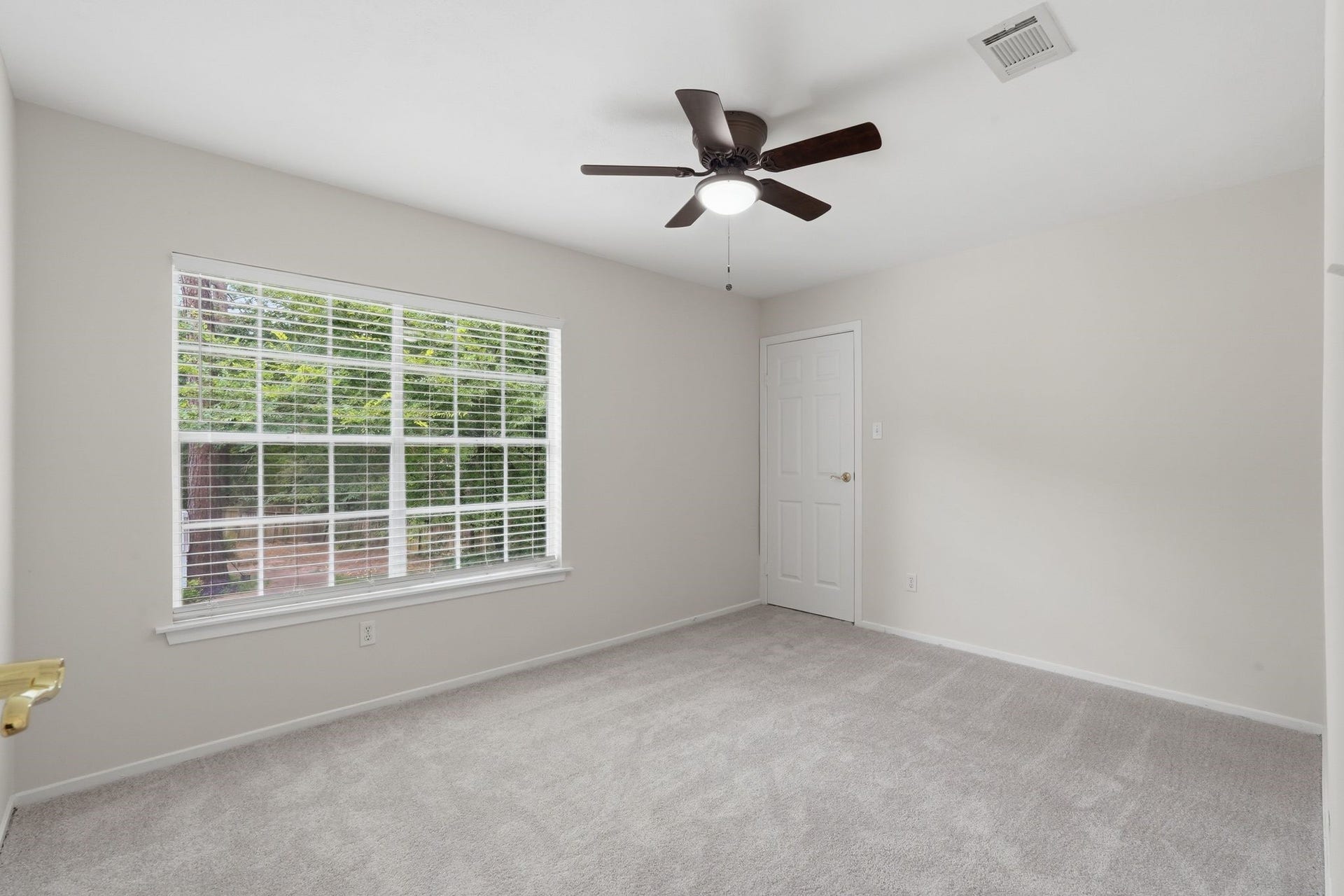 10916 Fawnlily Street, The Woodlands, TX 77380 At the top of the stairs to the left, you'll see another secondary bedroom with its own walk in closet too and large windows.
