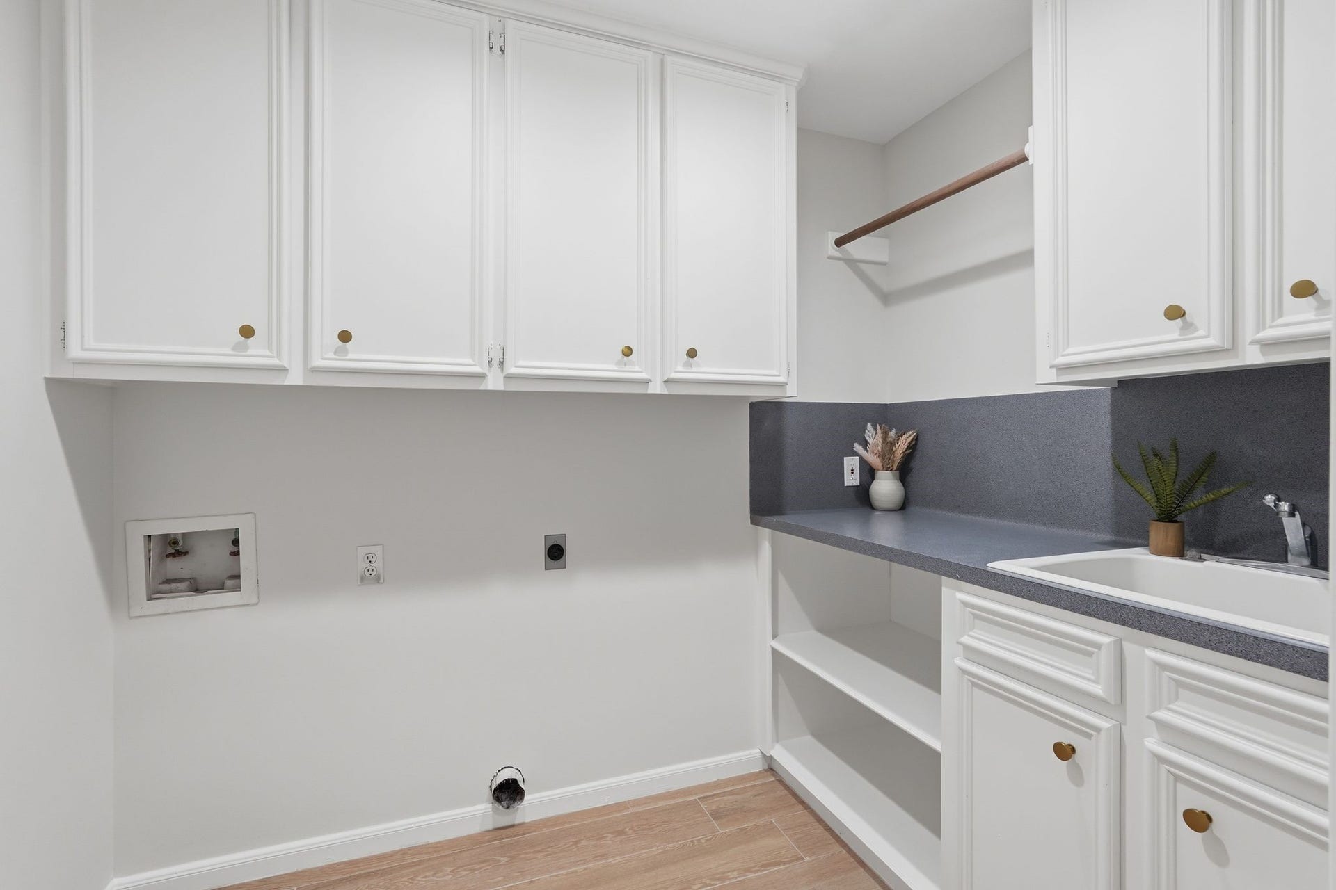 10916 Fawnlily Street, The Woodlands, TX 77380 This laundry room has it all! It includes tons of storage, space to hang your clothes, a place to fold it AND a sink? YES PLEASE!