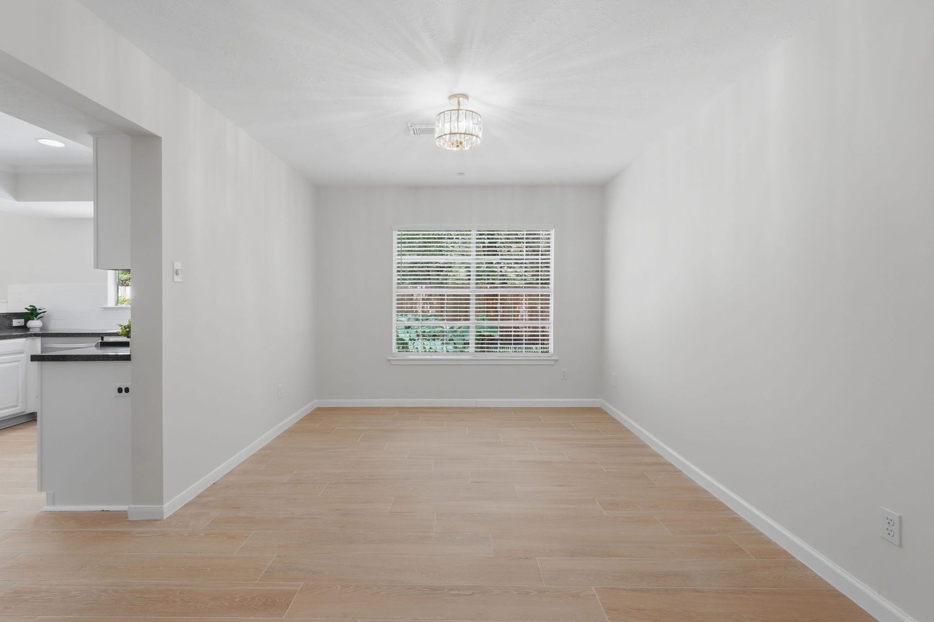 10916 Fawnlily Street, The Woodlands, TX 77380 This room is ready to be filled with laughter and delicious food. All it needs is your table, chairs, and your favorite meal.