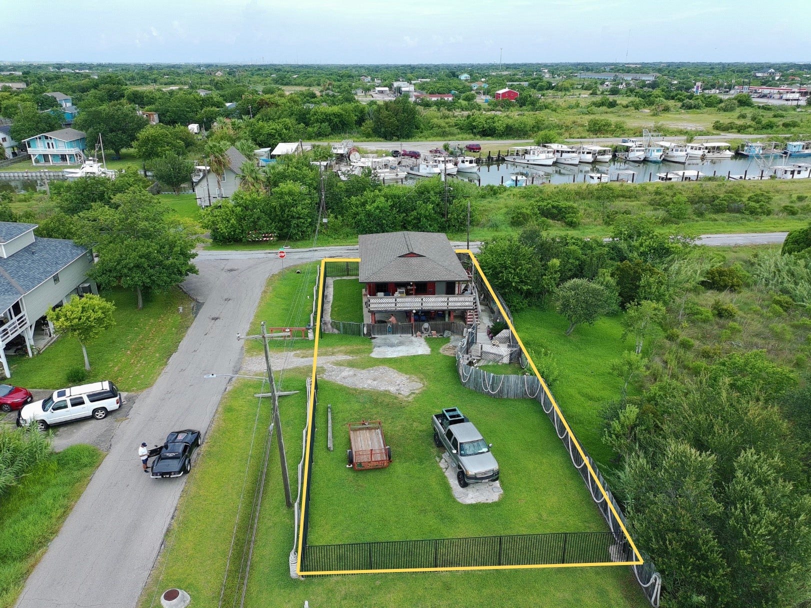1019 Sunset Drive, San Leon, TX 77539 overhead view shows proximity to water (red house) (yellow boundary lines are approximate, refer to provided survey)
