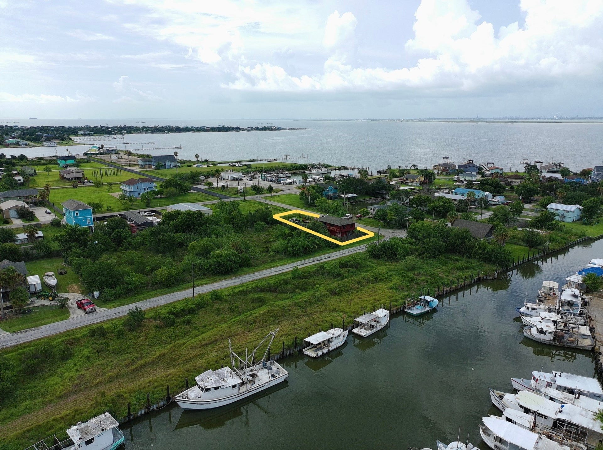 1019 Sunset Drive, San Leon, TX 77539 overhead view shows proximity to water (red house) (yellow boundary lines are approximate, refer to provided survey)