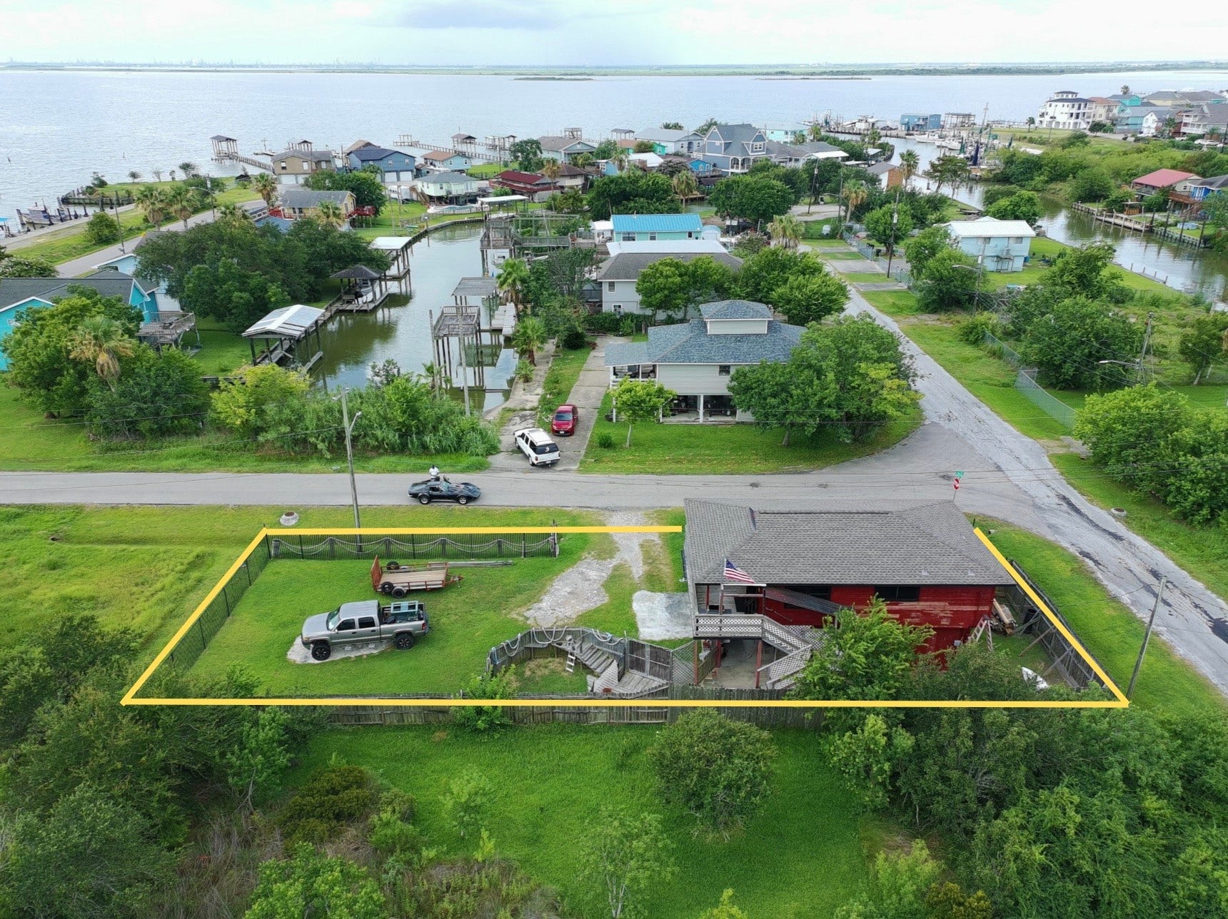 1019 Sunset Drive, San Leon, TX 77539 overhead view shows proximity to water (red house) (yellow boundary lines are approximate, refer to provided survey)