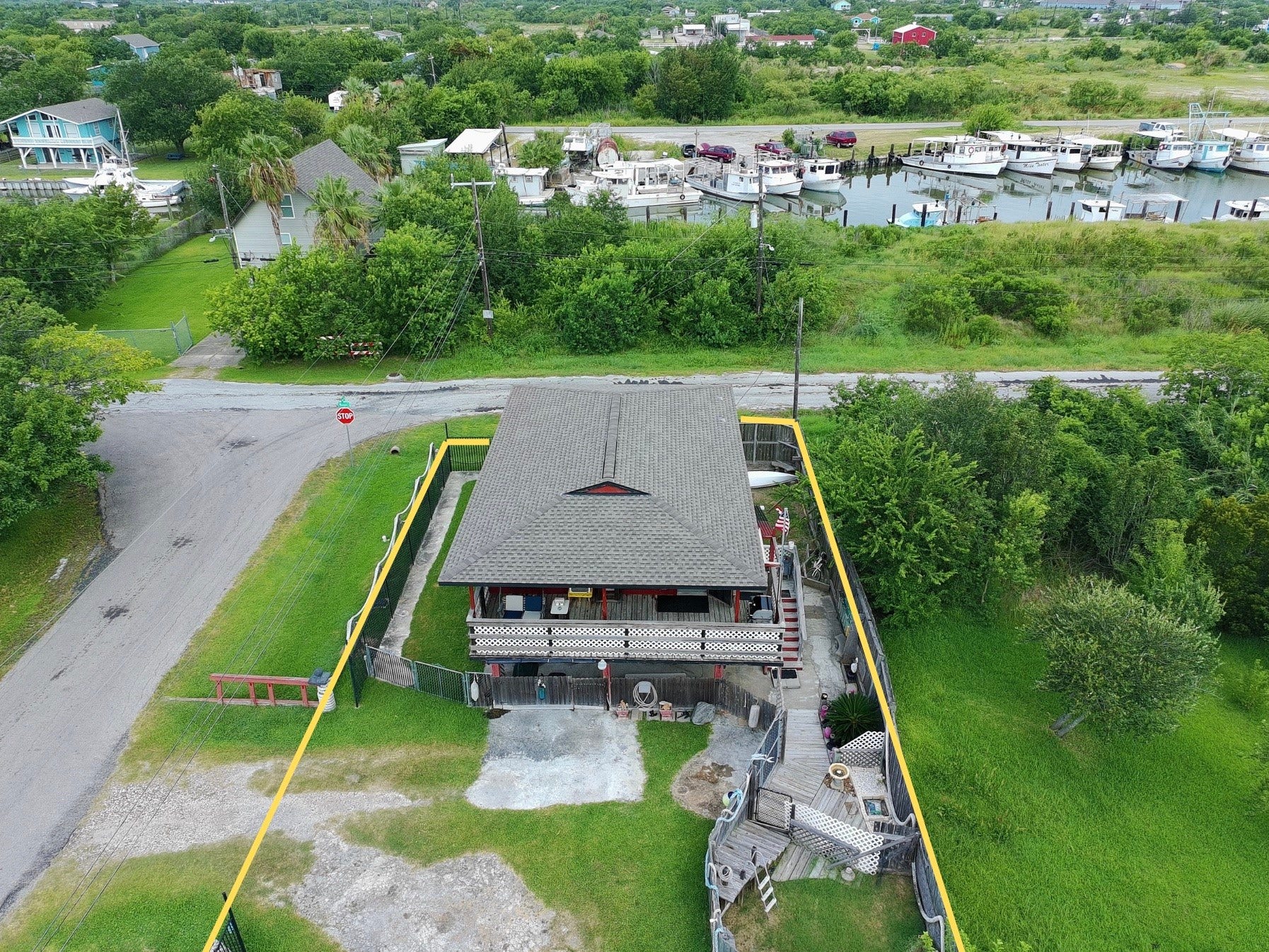 1019 Sunset Drive, San Leon, TX 77539 overhead view shows proximity to water (red house) (yellow boundary lines are approximate, refer to provided survey)