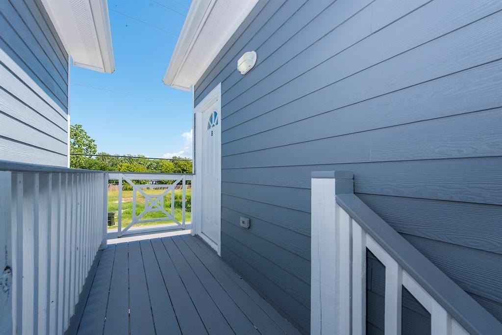 203 6th St, #D, San Leon, TX 77539 The upstairs landing right outside the front door.
