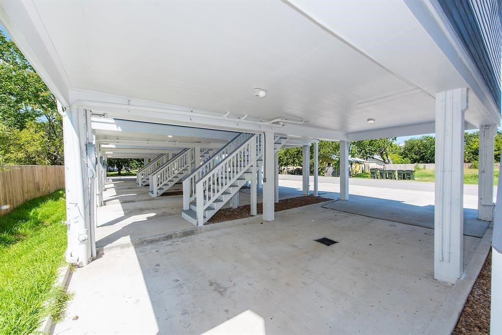 203 6th St, #D, San Leon, TX 77539 Underneath the homes. Small grassy area behind the homes.