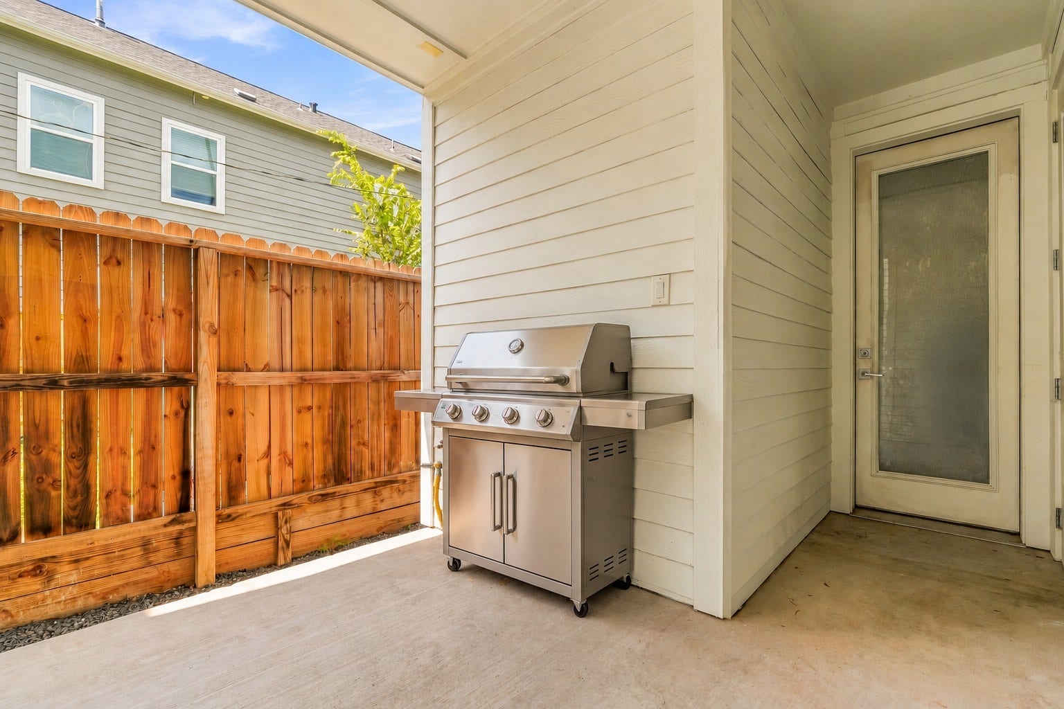 3109 Arlington Street, Houston, TX 77018 Virtually Staged Grill: Natural gas hookup on the wall, providing a convenient option for connecting a gas grill.