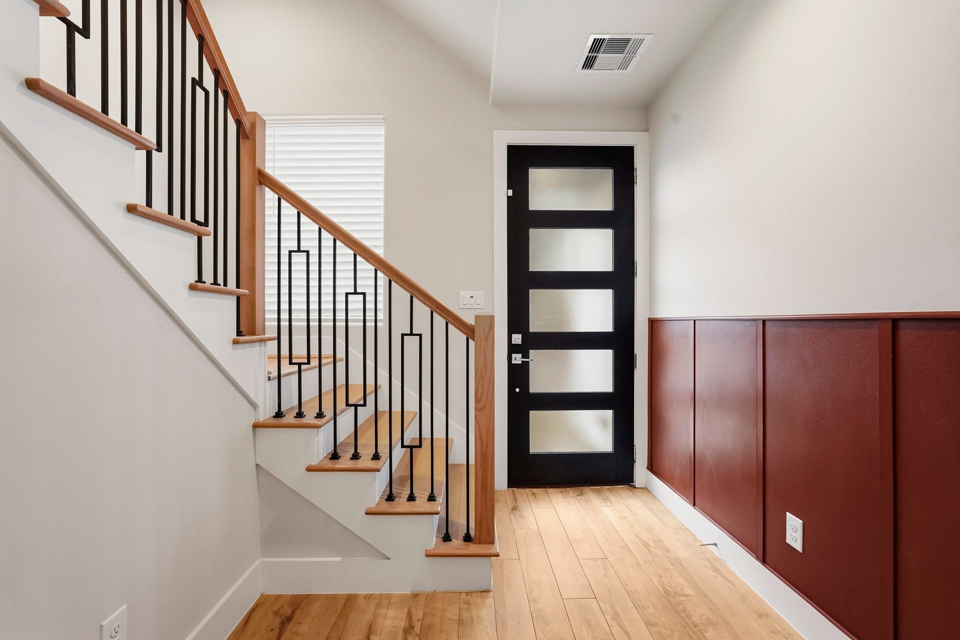 3109 Arlington Street, Houston, TX 77018 Contrasting wood-paneled wainscoting adds character to the space, while a large window brings in additional natural light.
