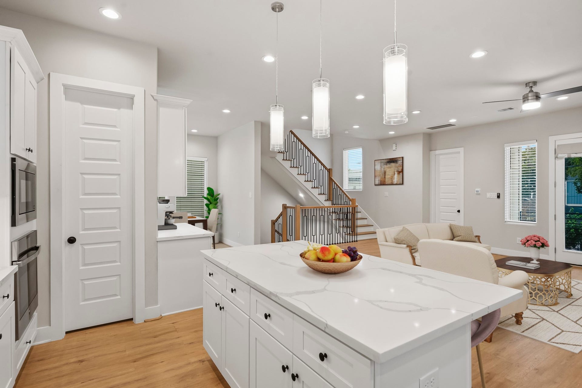 3109 Arlington Street, Houston, TX 77018 Virtually Staged: The kitchen flows seamlessly into the inviting living room, while luxury vinyl plank flooring and recessed lighting carry throughout the space.
