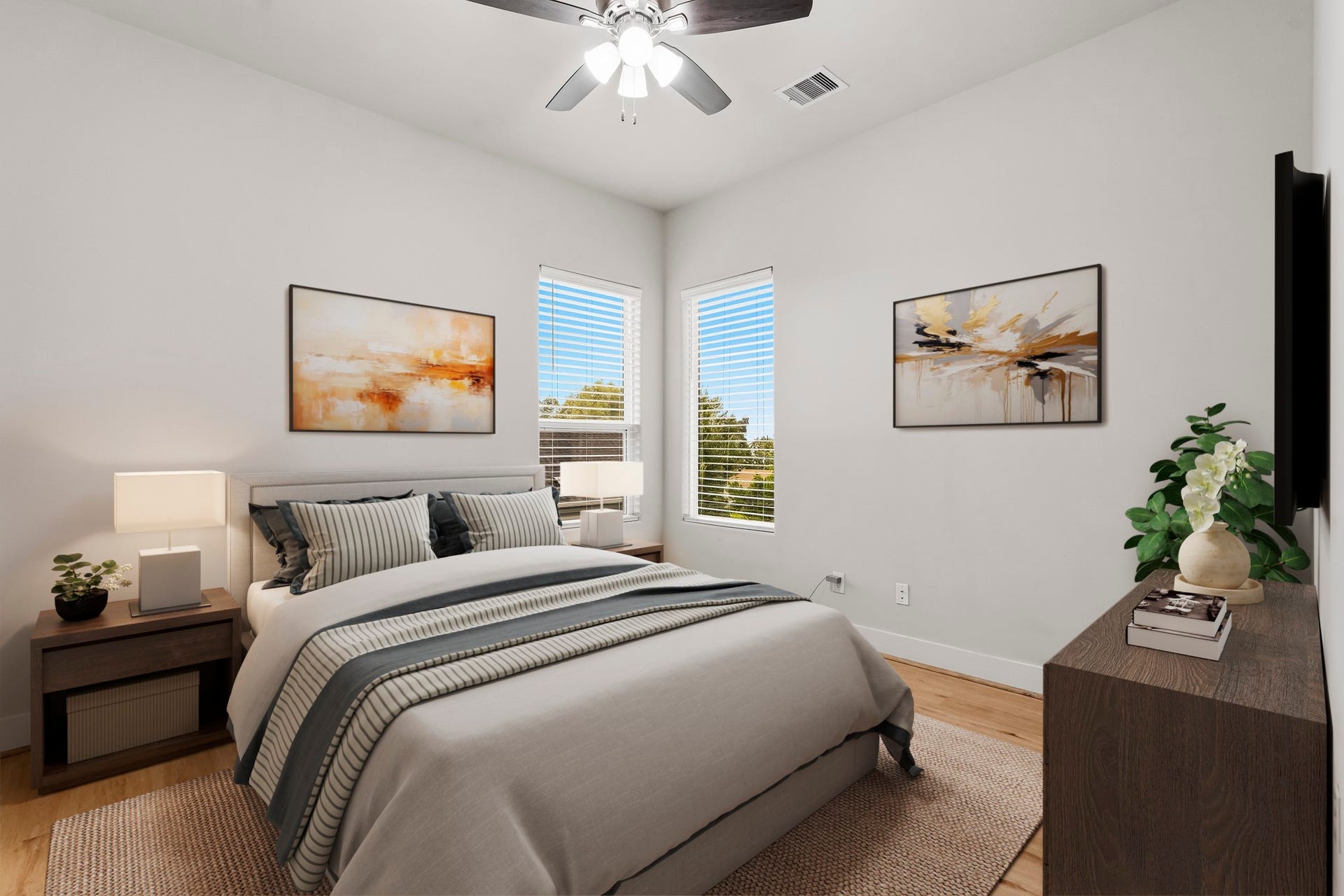 3109 Arlington Street, Houston, TX 77018 Virtually Staged: This bright and inviting secondary bedroom features luxury vinyl plank flooring, a ceiling fan, neutral finishes, and abundant natural light from two corner windows.