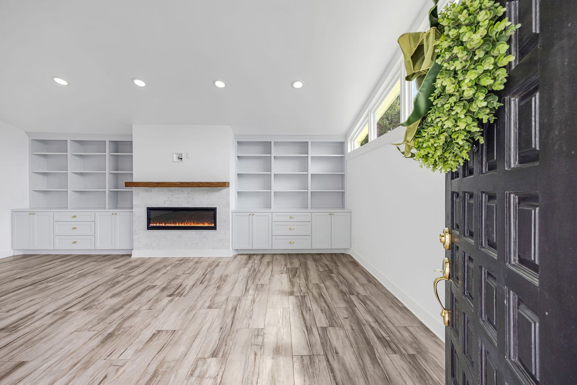 5250 Beechnut Street, Houston, TX 77096 Custom bookshelves and fireplace welcome you as you walk through the front door
