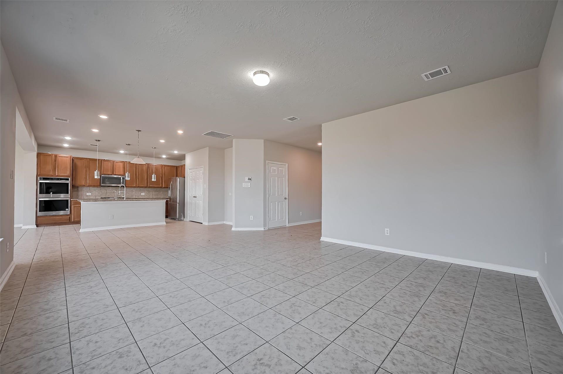 24114 Morrison Lane, Katy, TX 77493 living room features tile flooring and neutral walls.