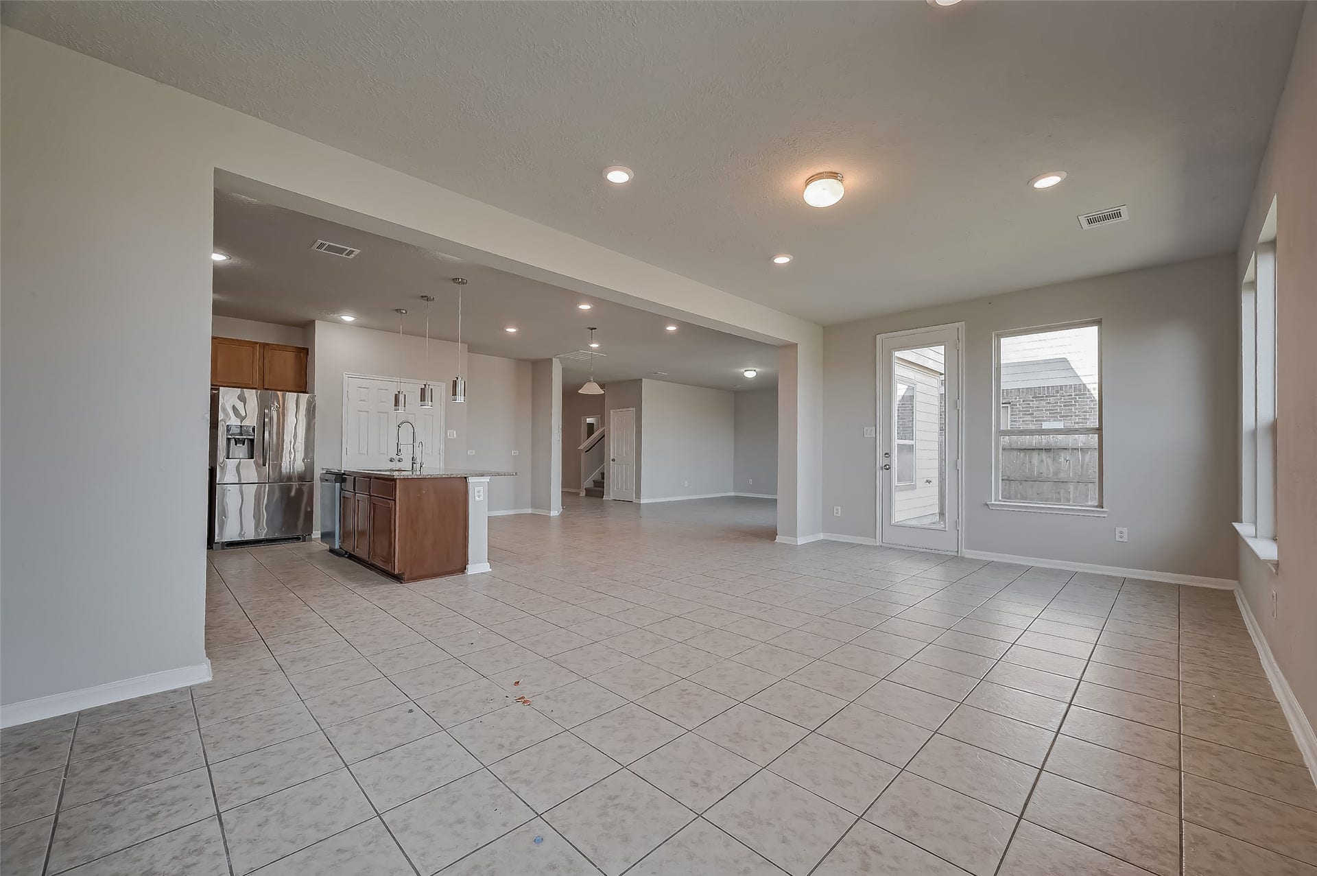 24114 Morrison Lane, Katy, TX 77493 Family room featuring a doorway to the yard.