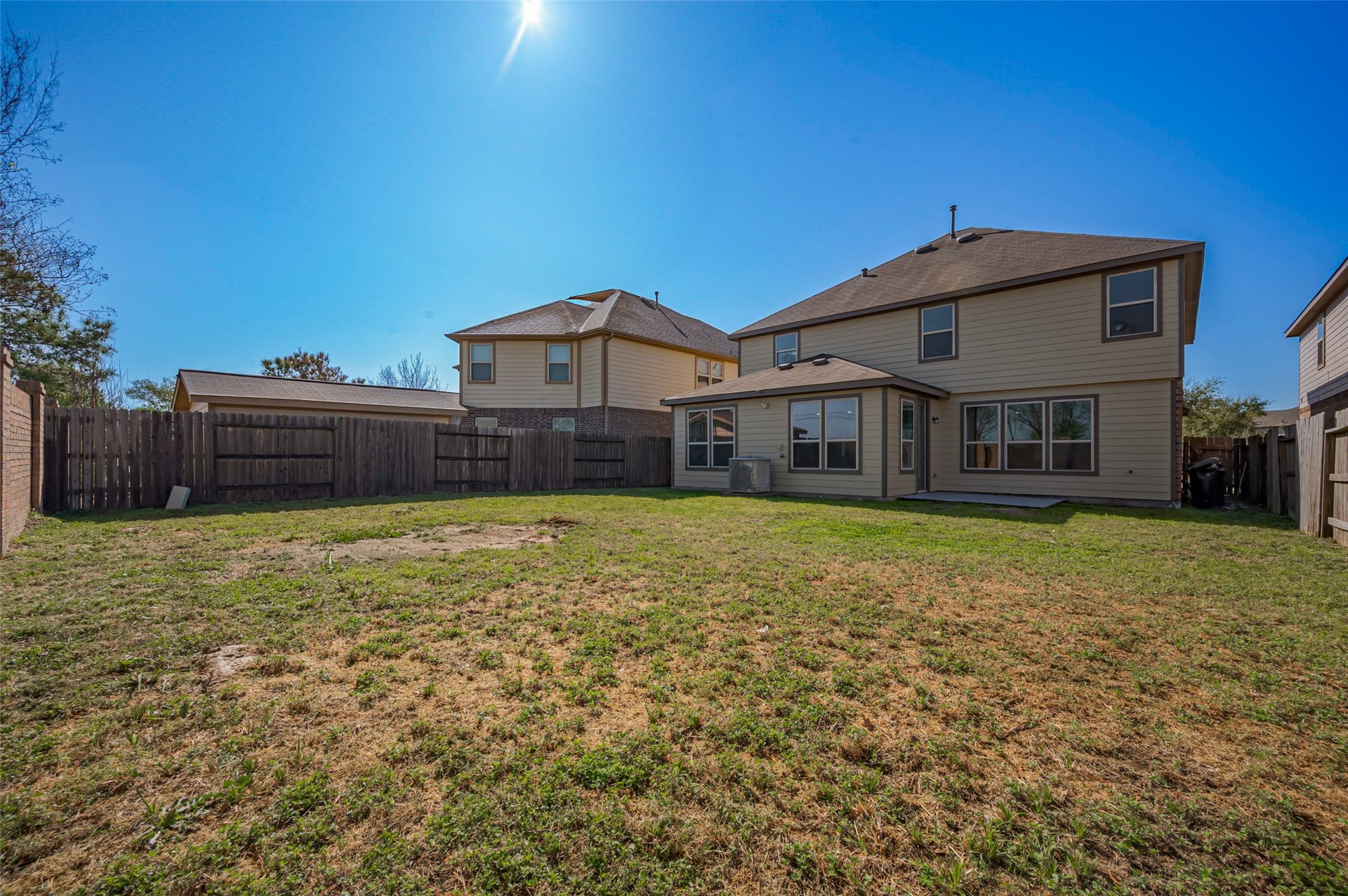 24114 Morrison Lane, Katy, TX 77493 Backyard featuring a fenced perimeter & well-maintained lawn.