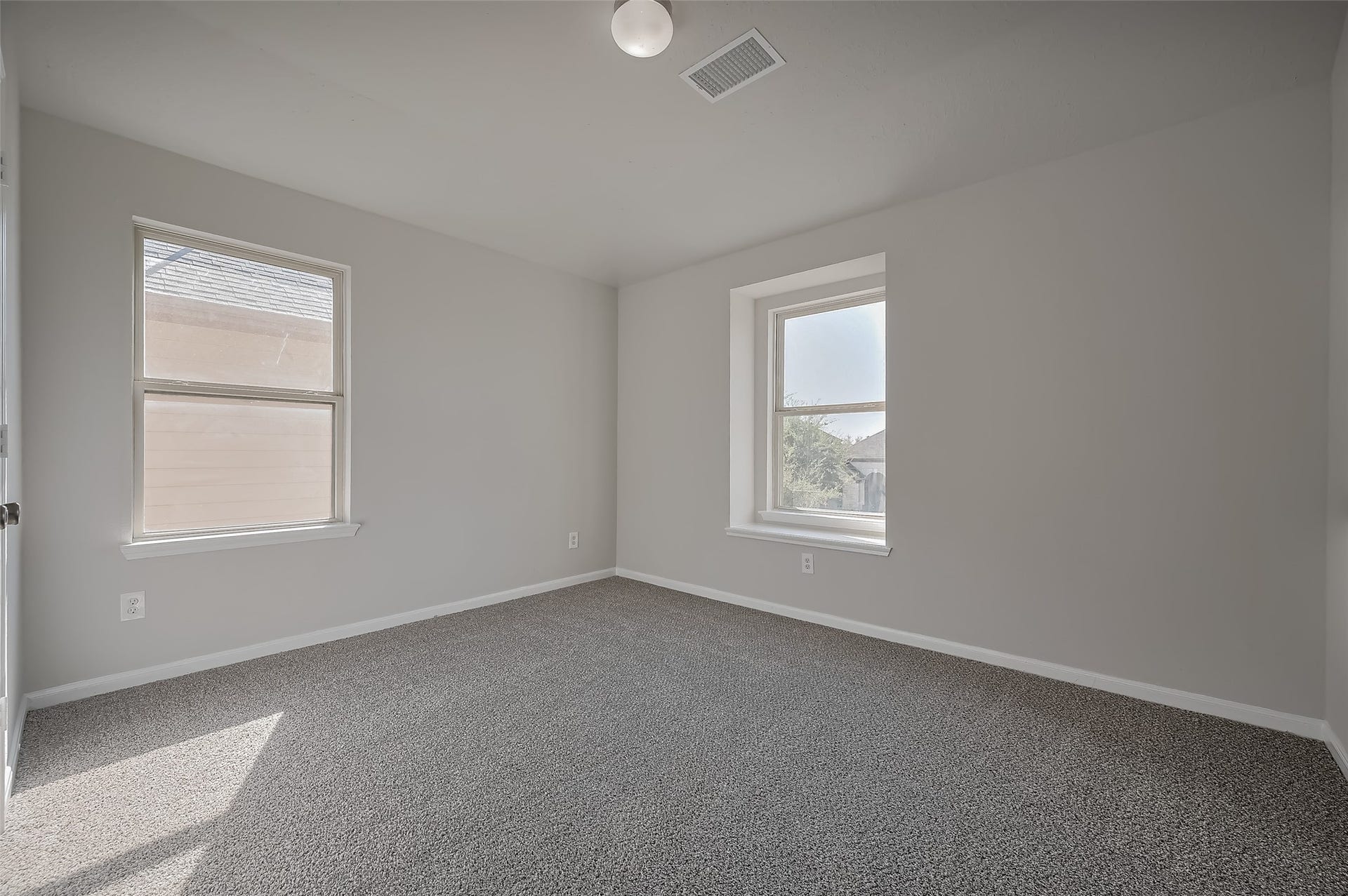24114 Morrison Lane, Katy, TX 77493 Cozy bedroom features two windows.