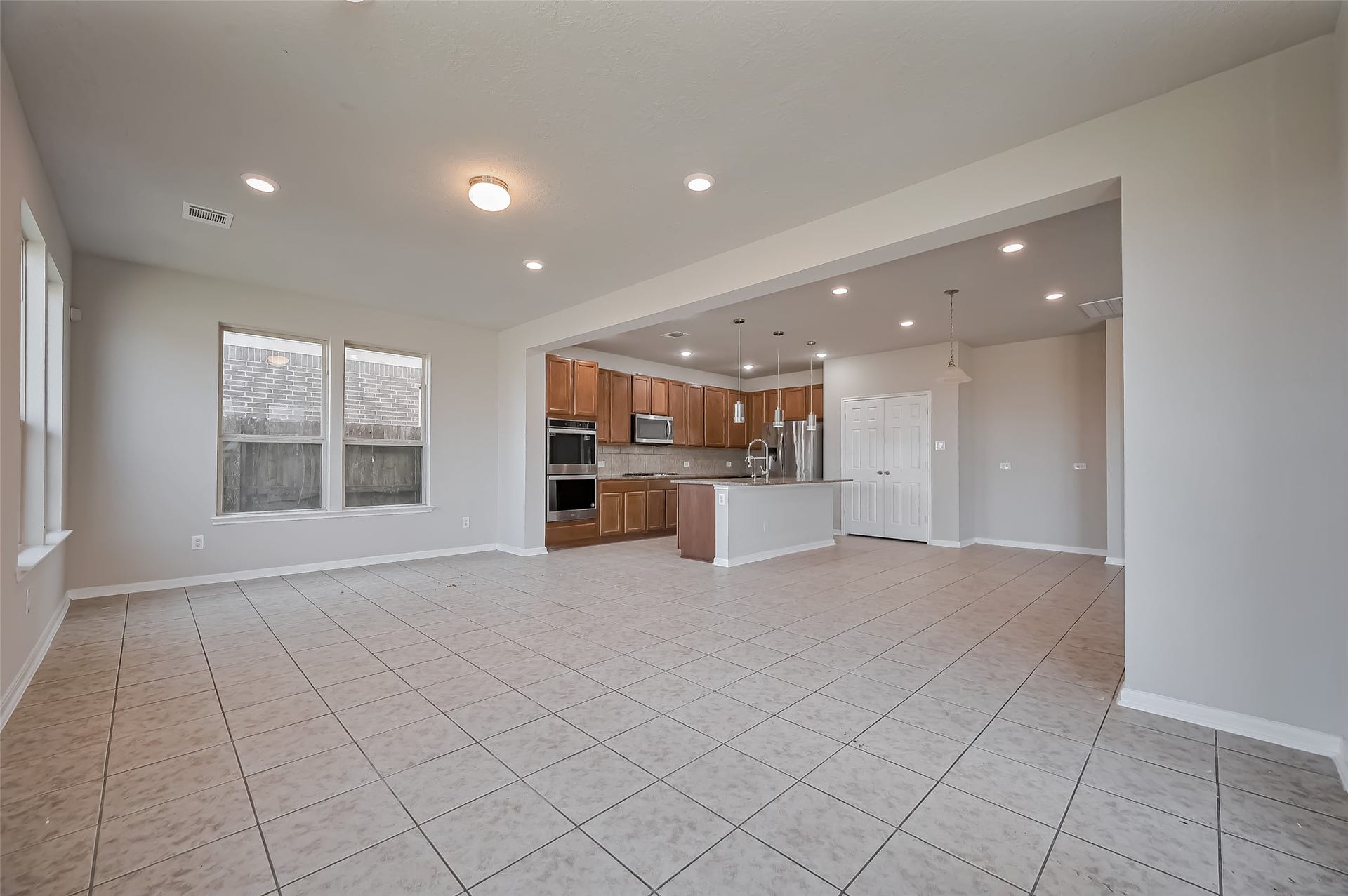 24114 Morrison Lane, Katy, TX 77493 Family room with a sleek kitchen design.